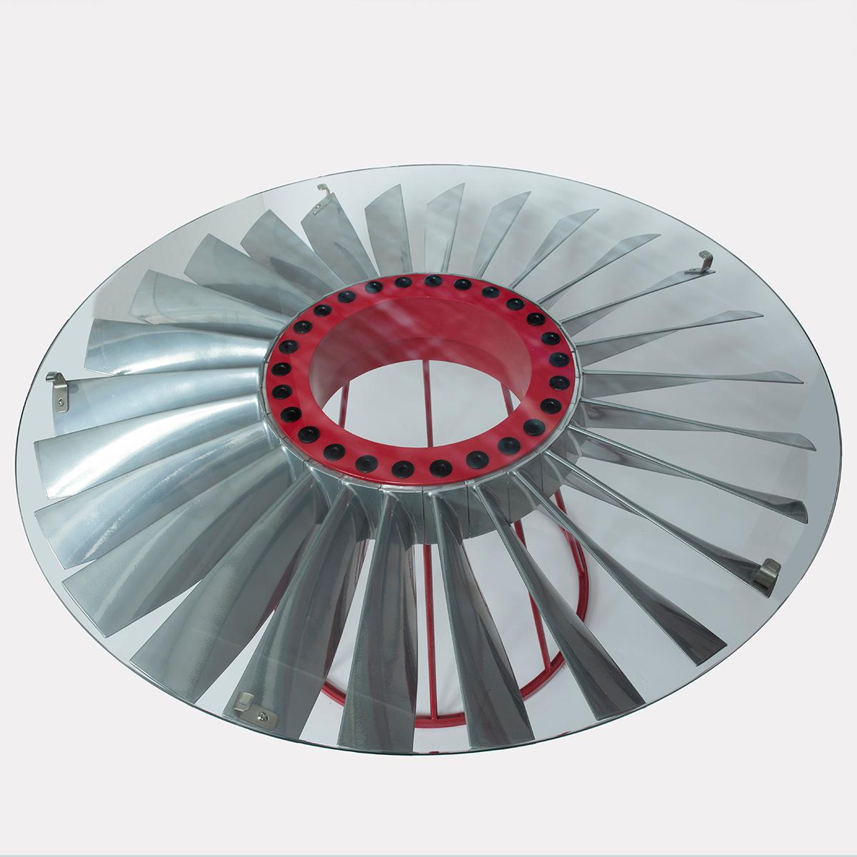 The base of our stunning coffee table is a chrome polished with RAF red painted central hub, fan blade from a Spey, Rolls Royce jet engine. This jet component would originally have been an integral part of a Spey engine which was widely and reliably
