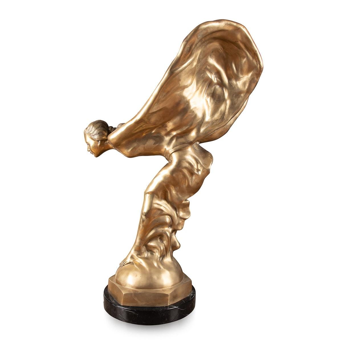 Mid-20th century monumental showroom display bronze of the legendary Rolls-Royce mascot which was designed by Charles Sykes R.A, the bronze sculpture set on a massive rurned marble plinth.

The Spirit of Ecstasy, also called Eleanor, Silver Lady,