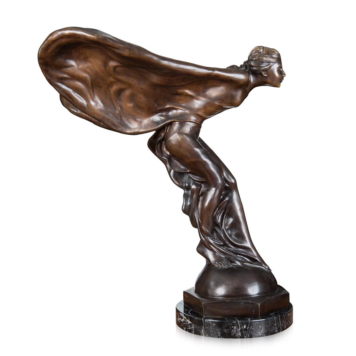 Antique early-20th Century French monumental showroom display bronze of the legendary Rolls-Royce mascot which was designed by Charles Sykes R.A, the dark patinated bronze sculpture set on a massive octagonal marble plinth. Signed by the artist in