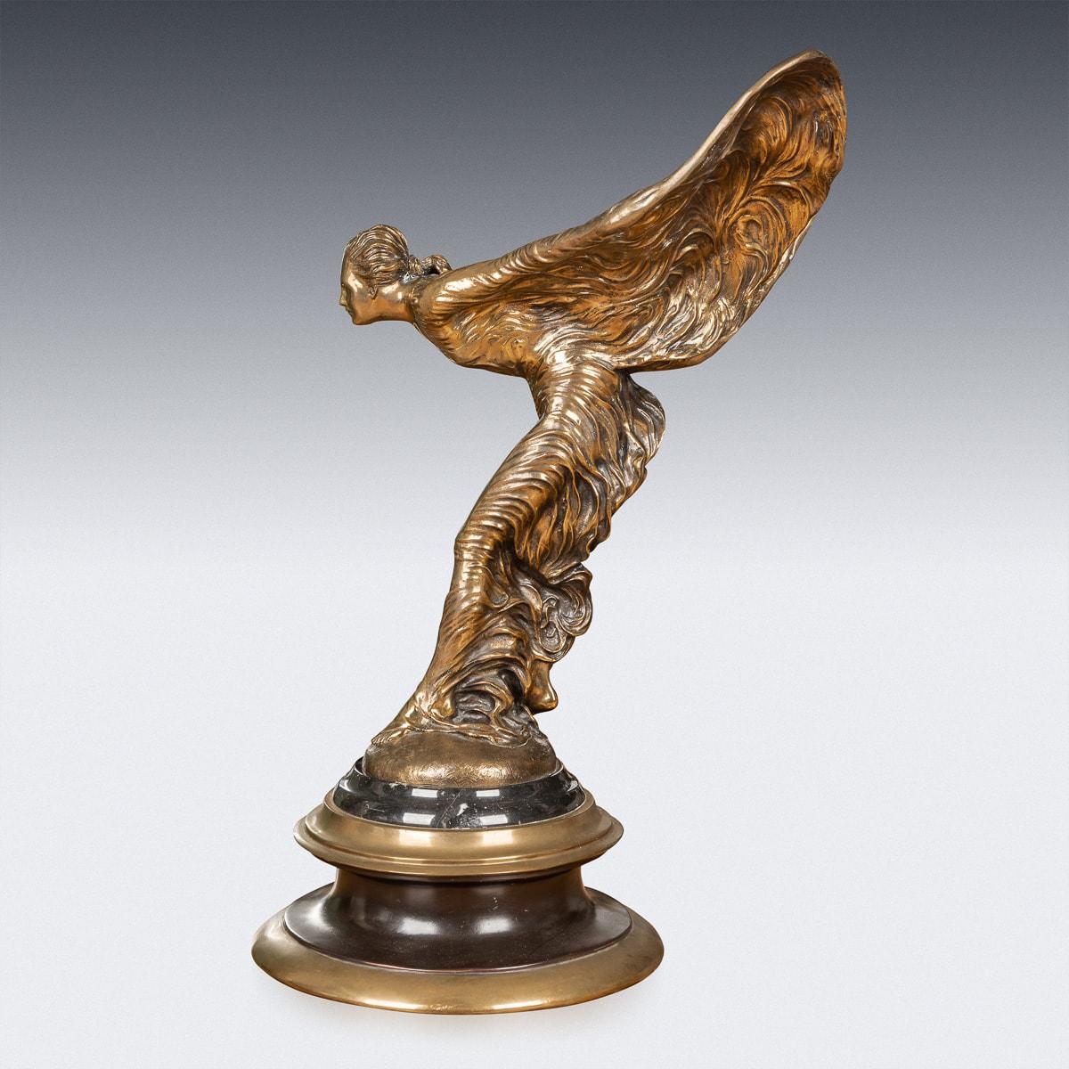 Mid-20th Century British showroom display bronze of the legendary Rolls-Royce mascot which was designed by Charles Sykes R.A, the patinated bronze sculpture is set on a round marble plinth. Signed Charles Sykes - (later cast). The Spirit of Ecstasy,