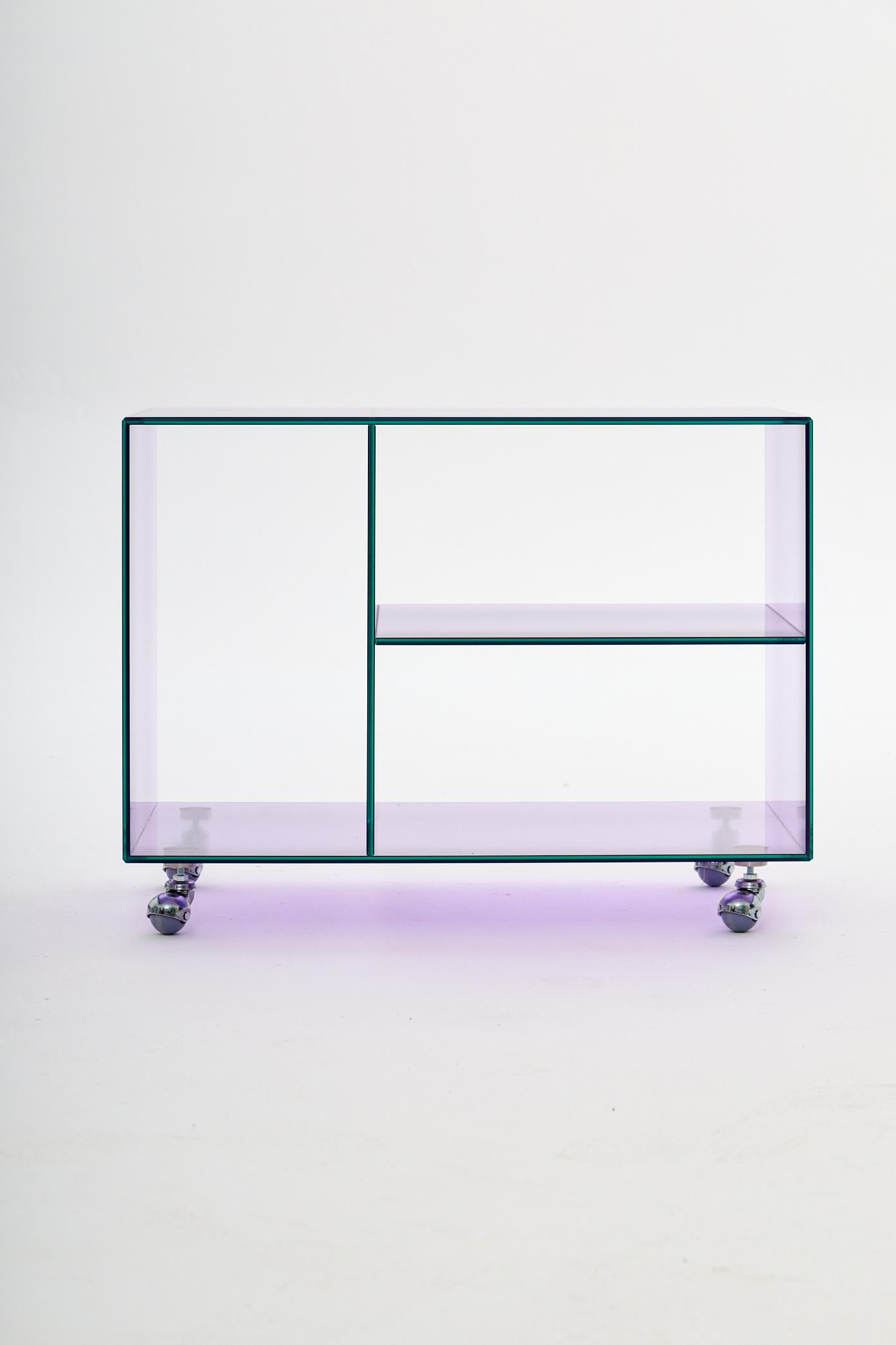 Roly Midi Lilac Trolley by Studio Monsoleil
Dimensions: D 40 x W 70 x H 53 cm.
Materials: Laminated glass.

Roly trolley is an Art Deco-inspired piece that brings a touch of 1920s opulence to any modern space, for those who appreciate classic style