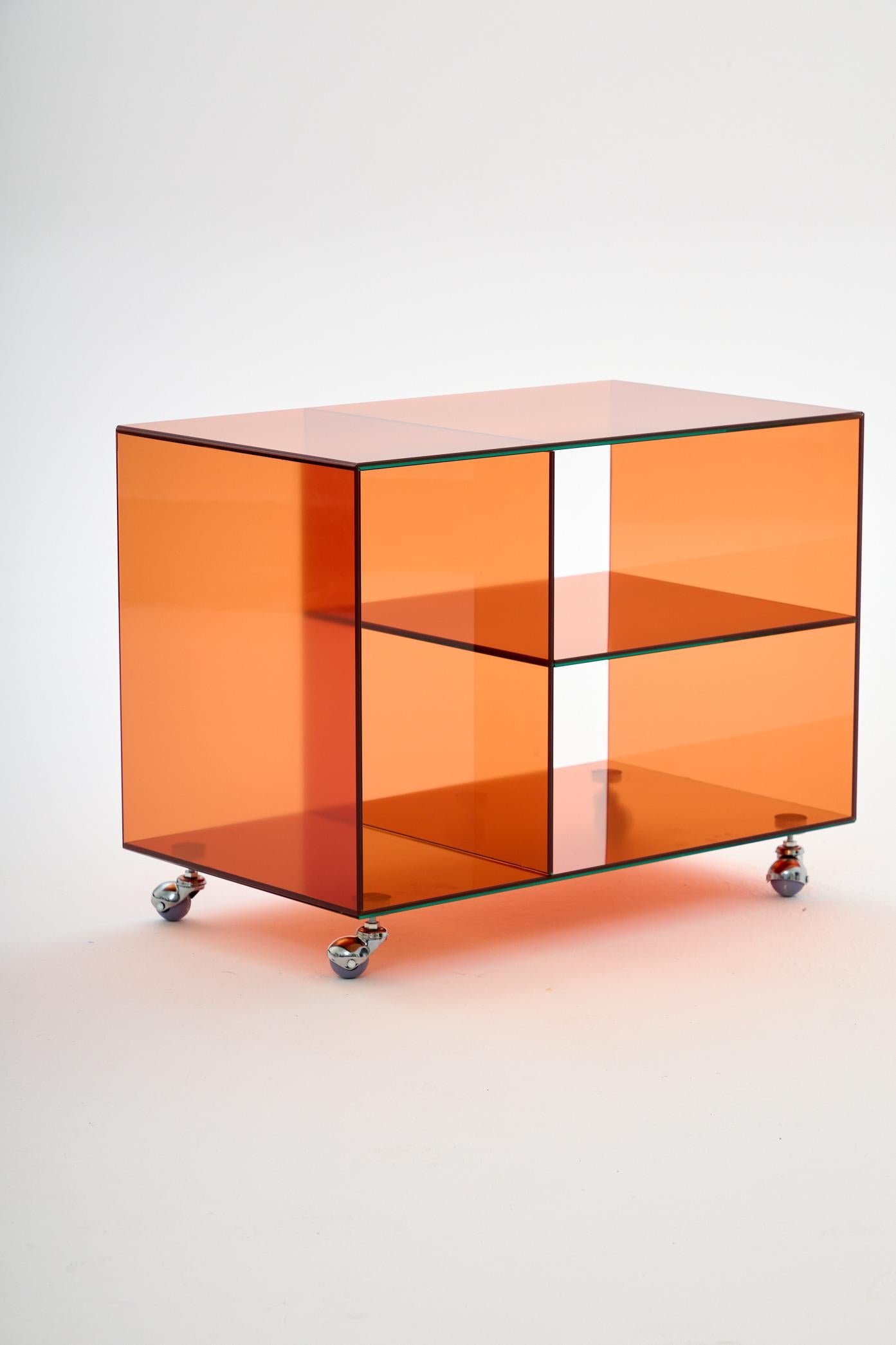 Roly Midi Orange Trolley by Studio Monsoleil
Dimensions: D 40 x W 70 x H 53 cm.
Materials: Laminated glass.

Roly trolley is an Art Deco-inspired piece that brings a touch of 1920s opulence to any modern space, for those who appreciate classic style