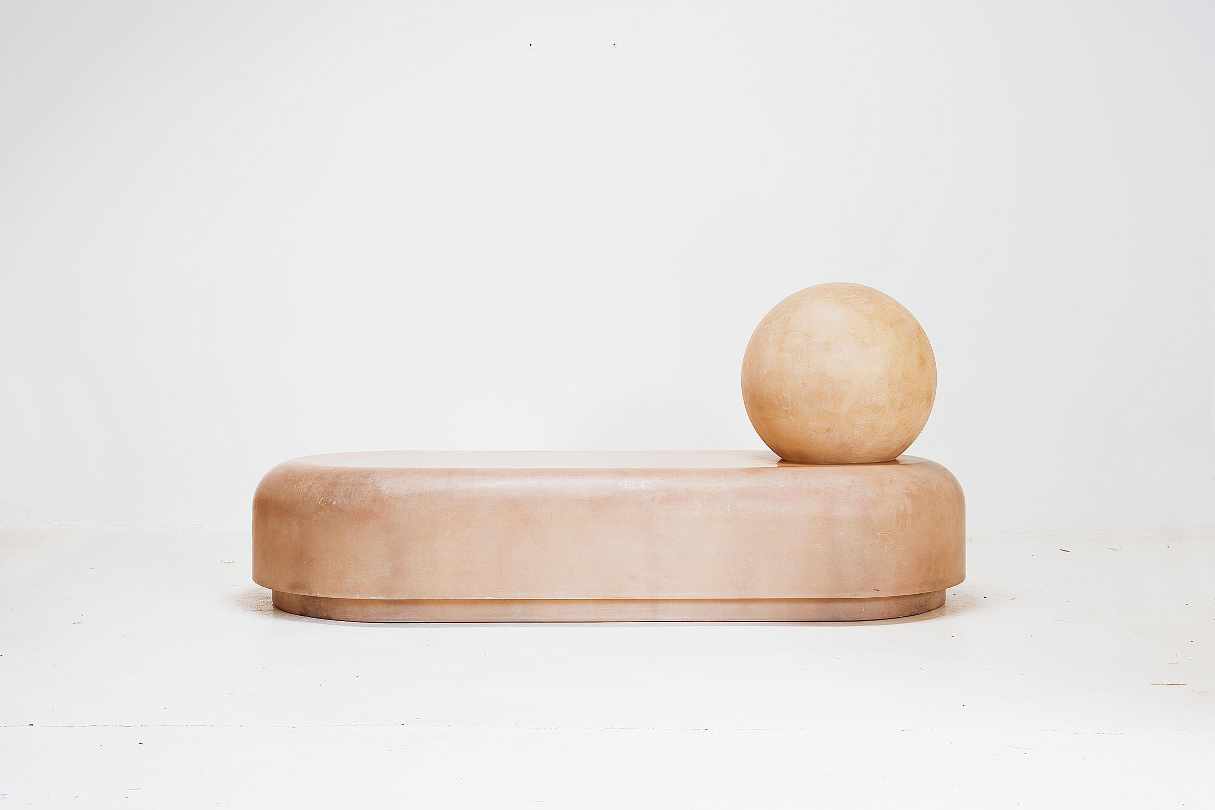 In a translucent fibreglass that appears almost faded, this rounded two-piece daybed comprises a spherical headrest and tablet-like body, both formed from glossy fibreglass.
Fibreglass.
Measures: 90cm high x 85cm deep x 200cm wide
35.43in x 33.46in
