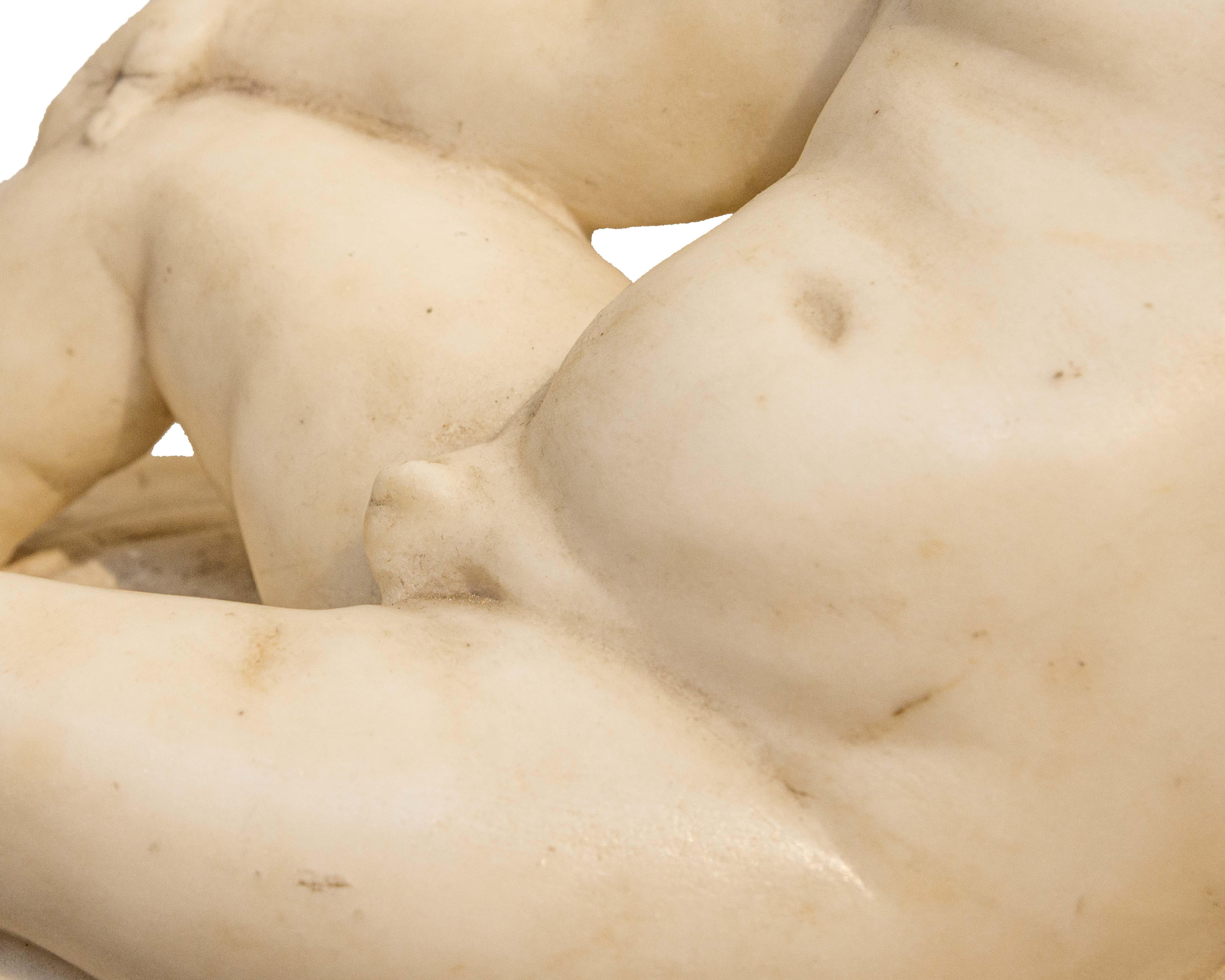 Marble Roma,  Putto sdraiato in marmo  XVII secolo For Sale