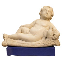 Rome,  Putto lying in marble  XVII Century