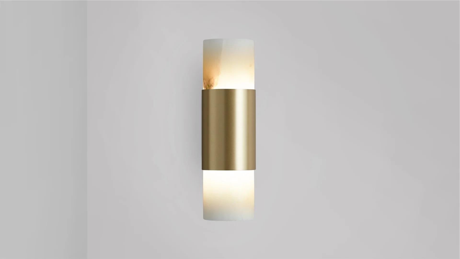 Roma wall lamp by CTO Lighting
Materials: satin brass, alabaster.
Dimensions: D 8.5 x W 5.5 x H 19 cm
Available in satin brass and bronze.

Celebrating the simplicity of line and form, The Roma collection is designed to highlight the noble quality