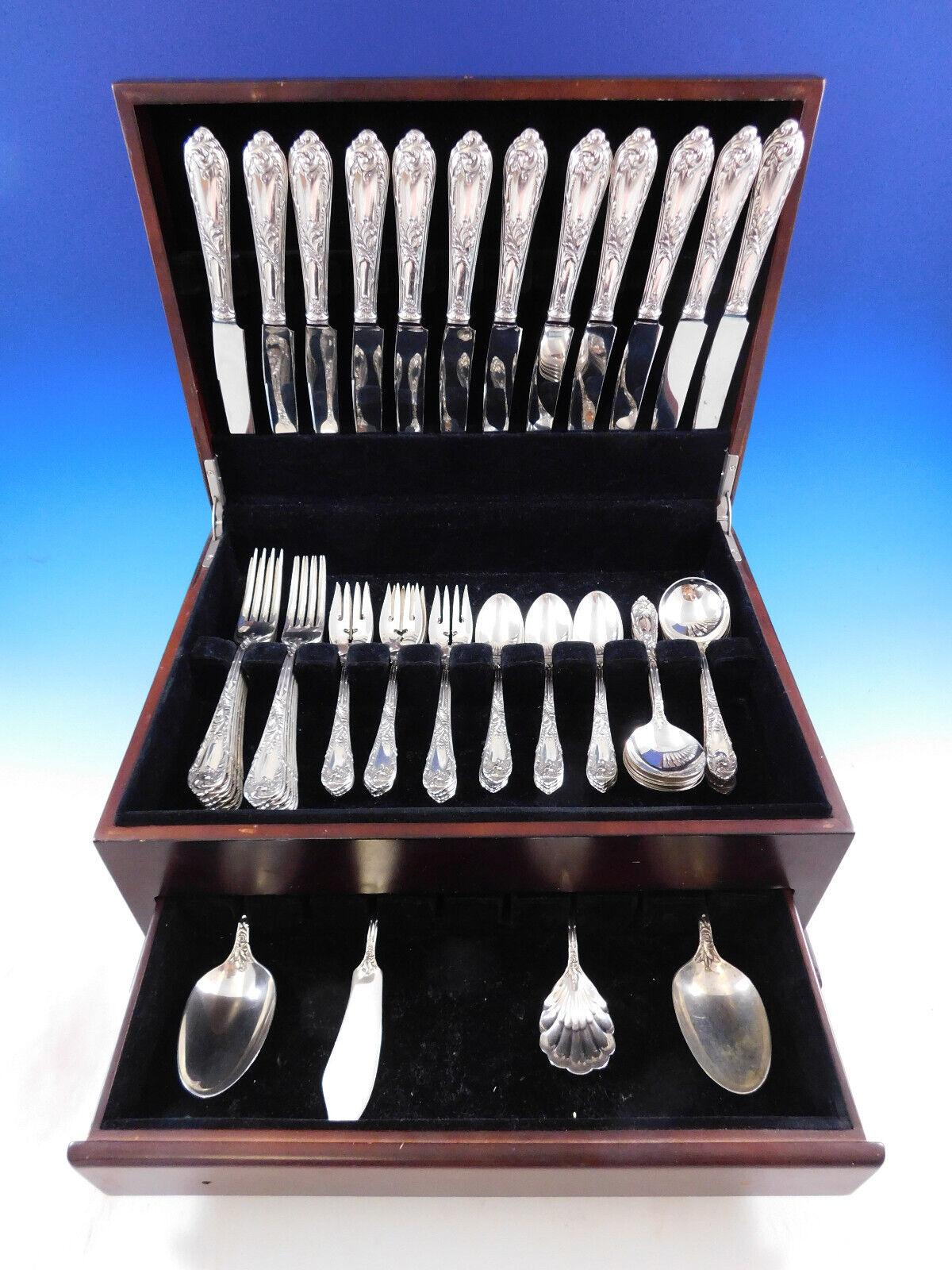Dinner size Romaine by Reed and Barton, circa 1933, sterling silver flatware set - 64 pieces. This set includes:


12 Dinner Size Knives, 9 3/4