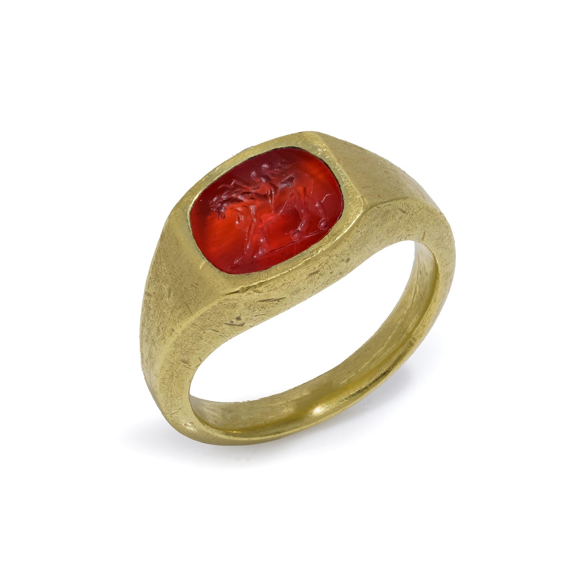 Classical Roman Roman carnelian intaglio with Cupid riding a Lion mounted in 22kt gold For Sale