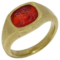 Roman carnelian intaglio with Cupid riding a Lion mounted in 22kt gold