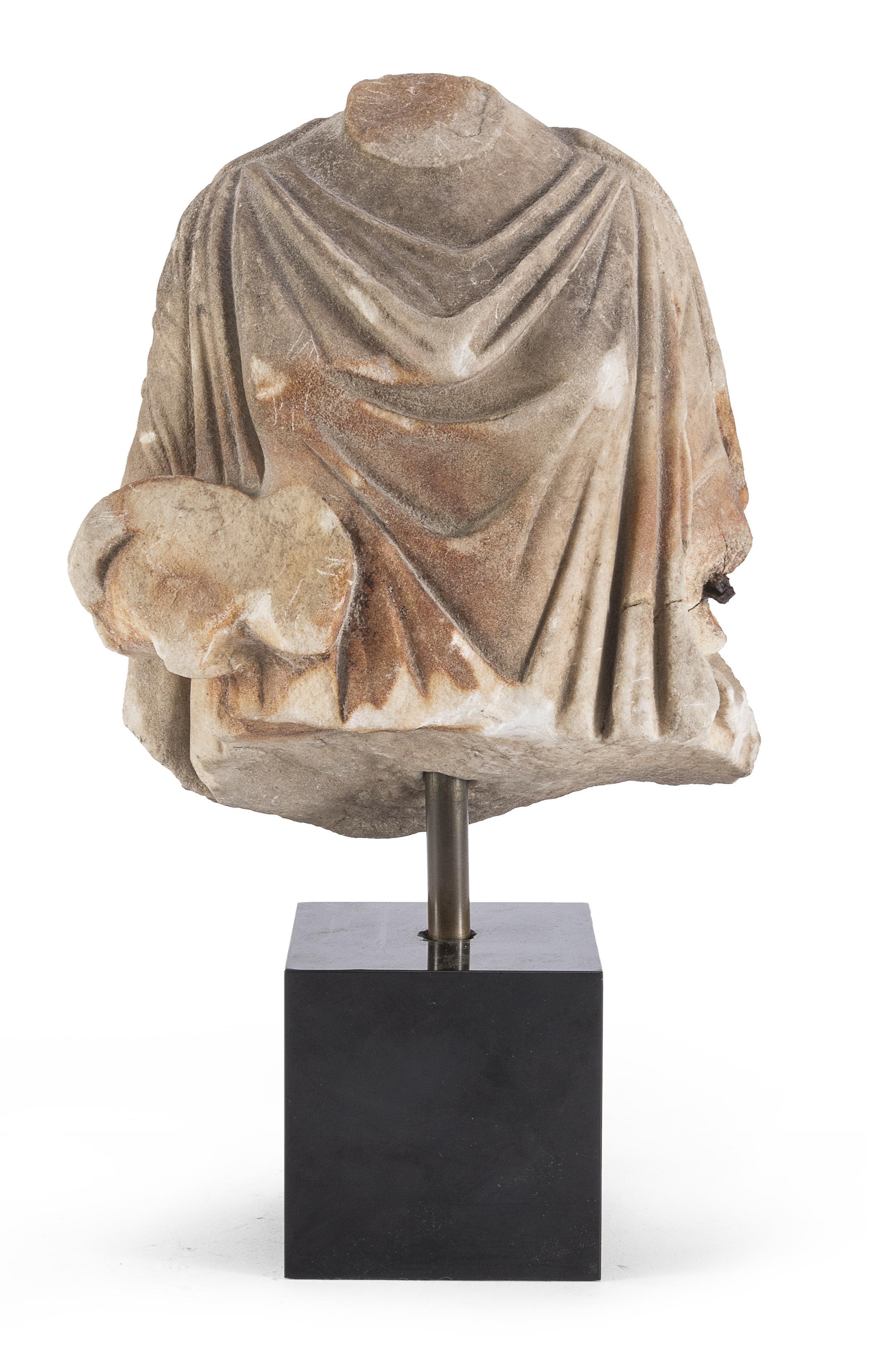 Beautiful Roman marble torso, most possibly depicting the Goddess Venus, draped with a Toga.
Beautiful accent piece,
2nd-3rd century AD, Rome. Authentified by the Sopraintendenza archeologica in Rome.