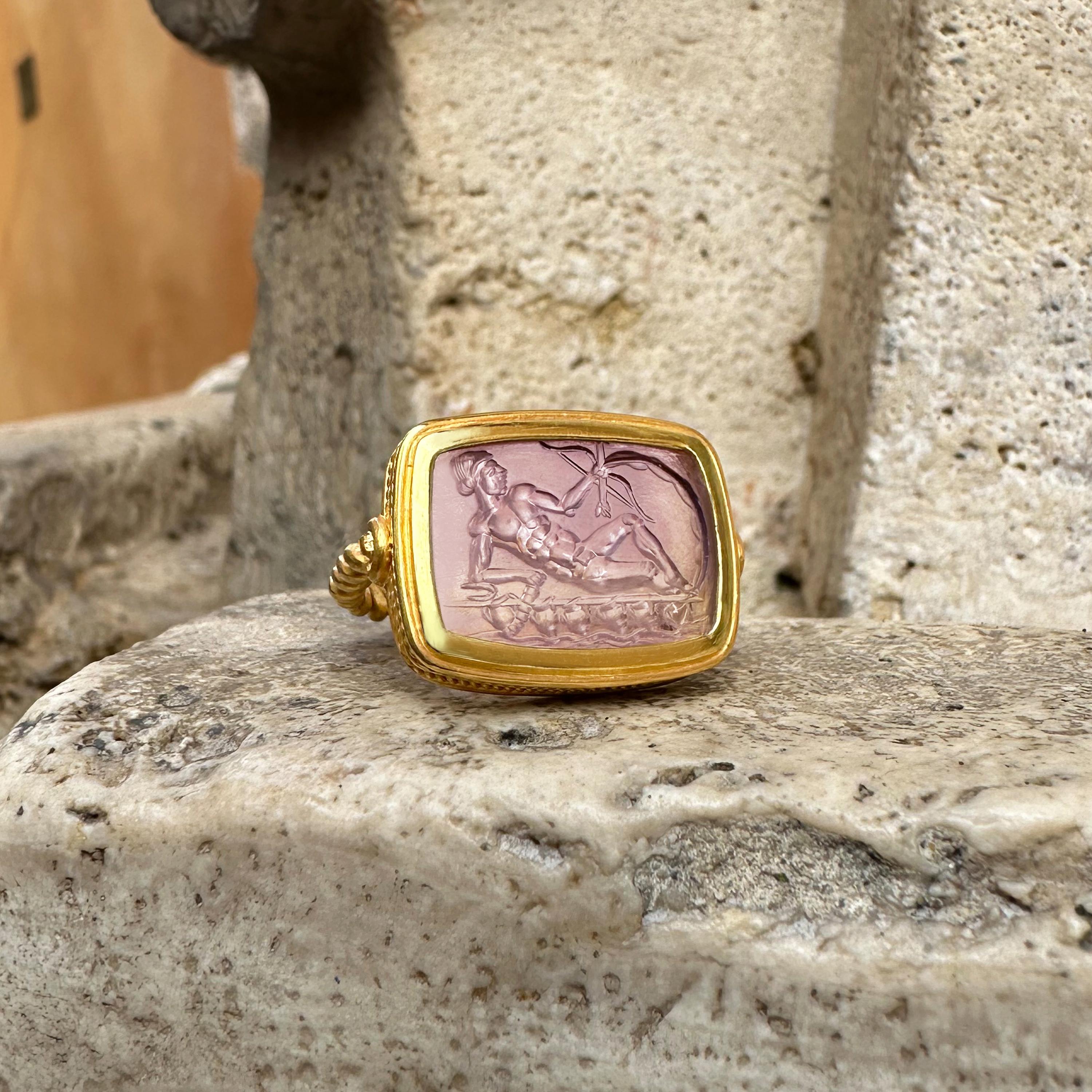 This exquisite 18 kt gold ring showcases a remarkable Roman intaglio on Amethyst, which dates back to the 1st-2nd century AD. The intaglio depicts the Greek God Apollo, a multifaceted deity in Greek mythology, associated with many aspects of