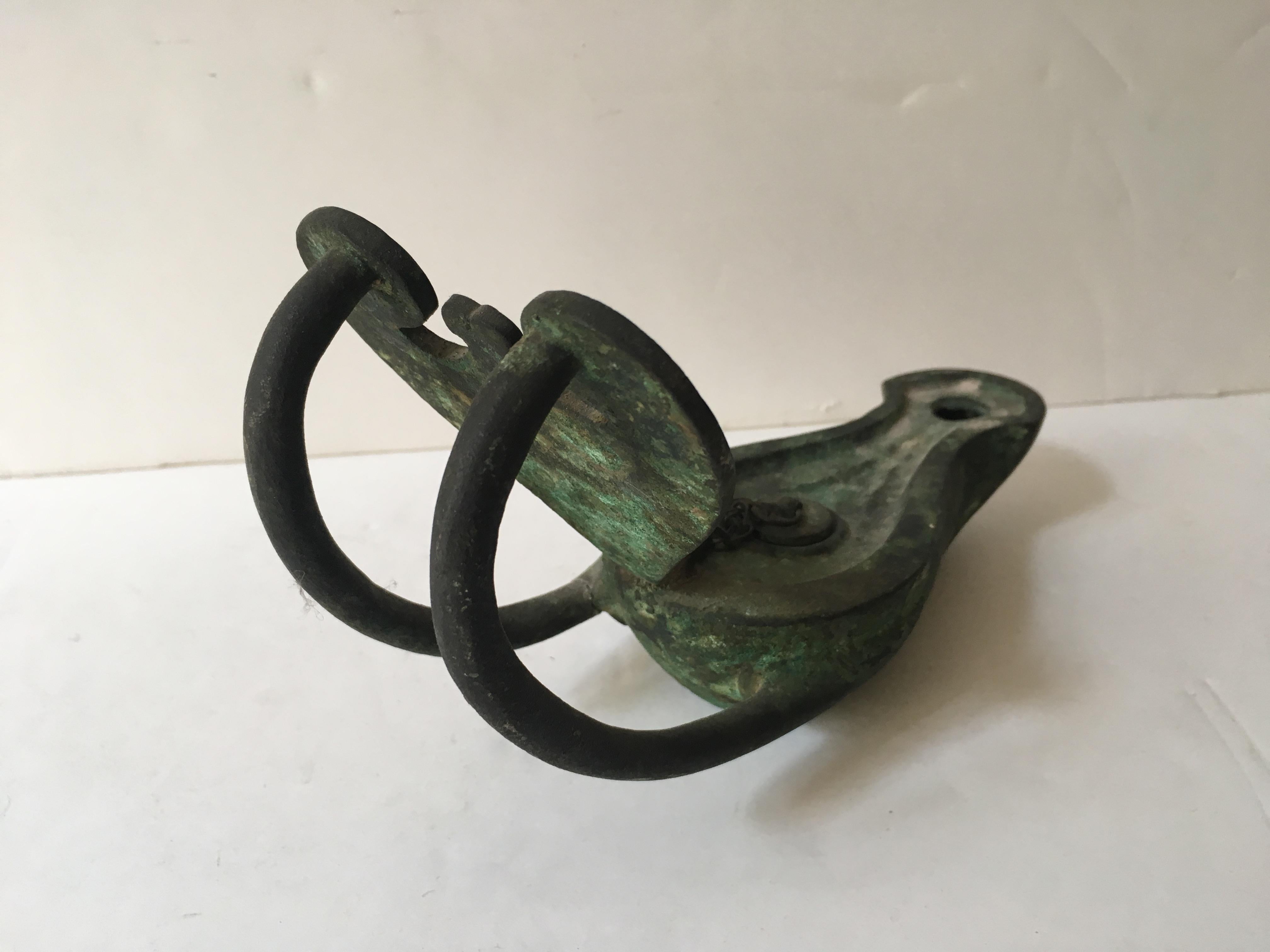 A roman bronze oil lamp, with a monkey sculpture, object of Grand Tour or possibly ancient.