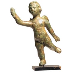 Statuette romaine en bronze du jeune dieu Eros "Cupidon".