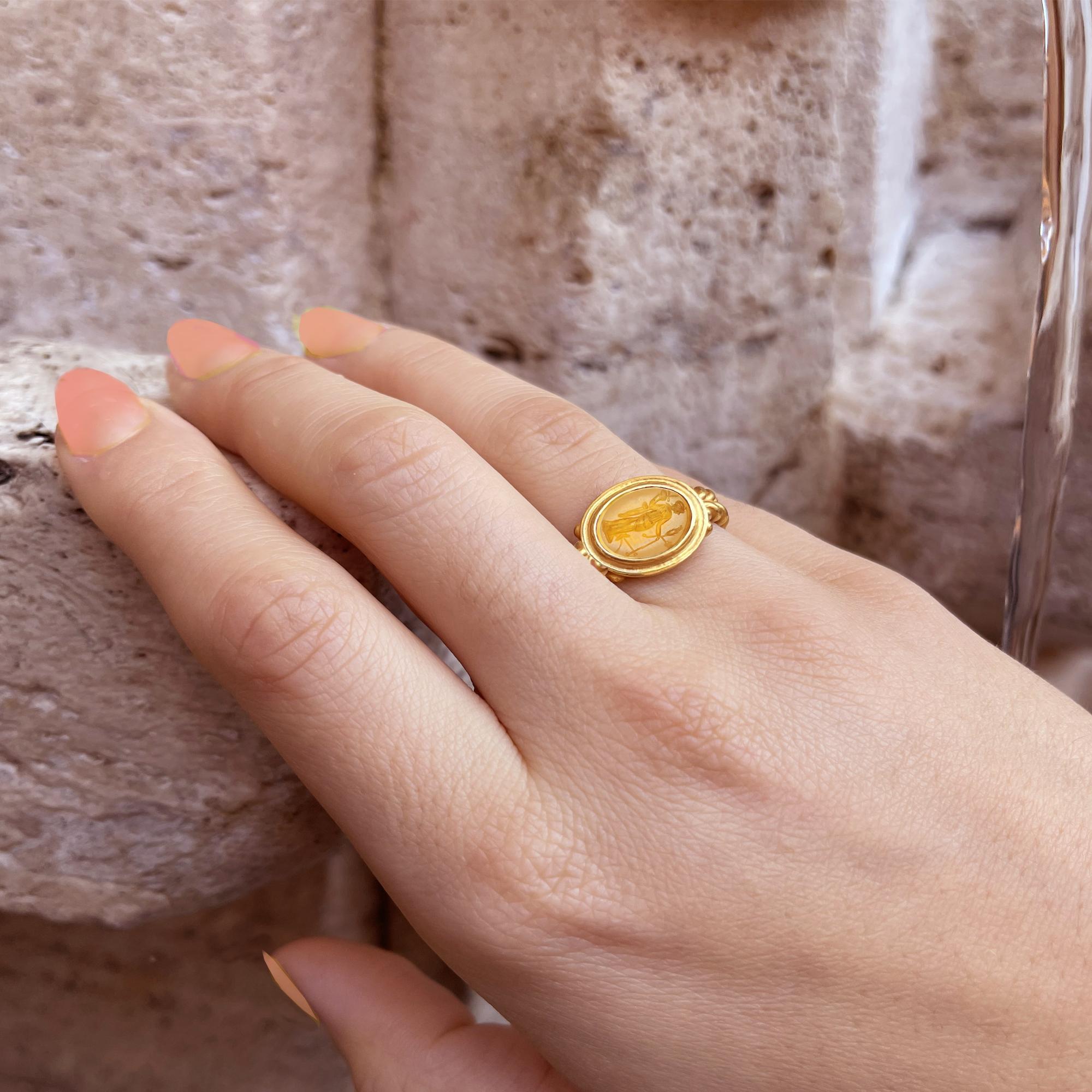 An authentic Roman carnelian from the 1st century AD has been set in this 18 kt gold ring. which depicts the goddess Fortuna with her most classic attributes: rudder, cornucopia, ear of corn and poppies; she wears the modius (a typical headdress of