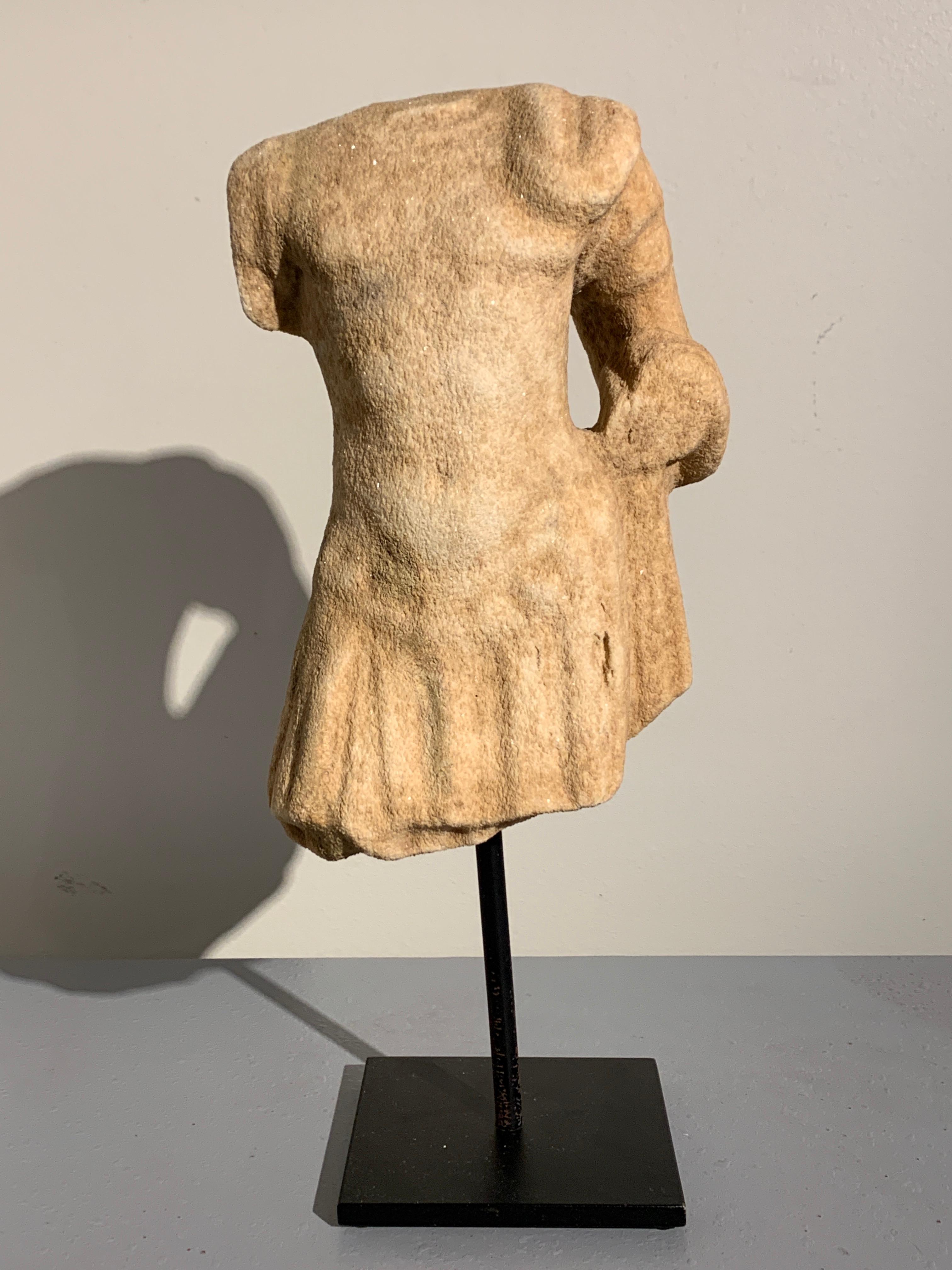A well carved Roman marble figure of a male in military dress, late Roman Period, circa 2nd-3rd century.

The figure portrayed dressed in military attire, wearing a cuirass molded with idealized musculature, a pleated skirt, known as a pterubes,