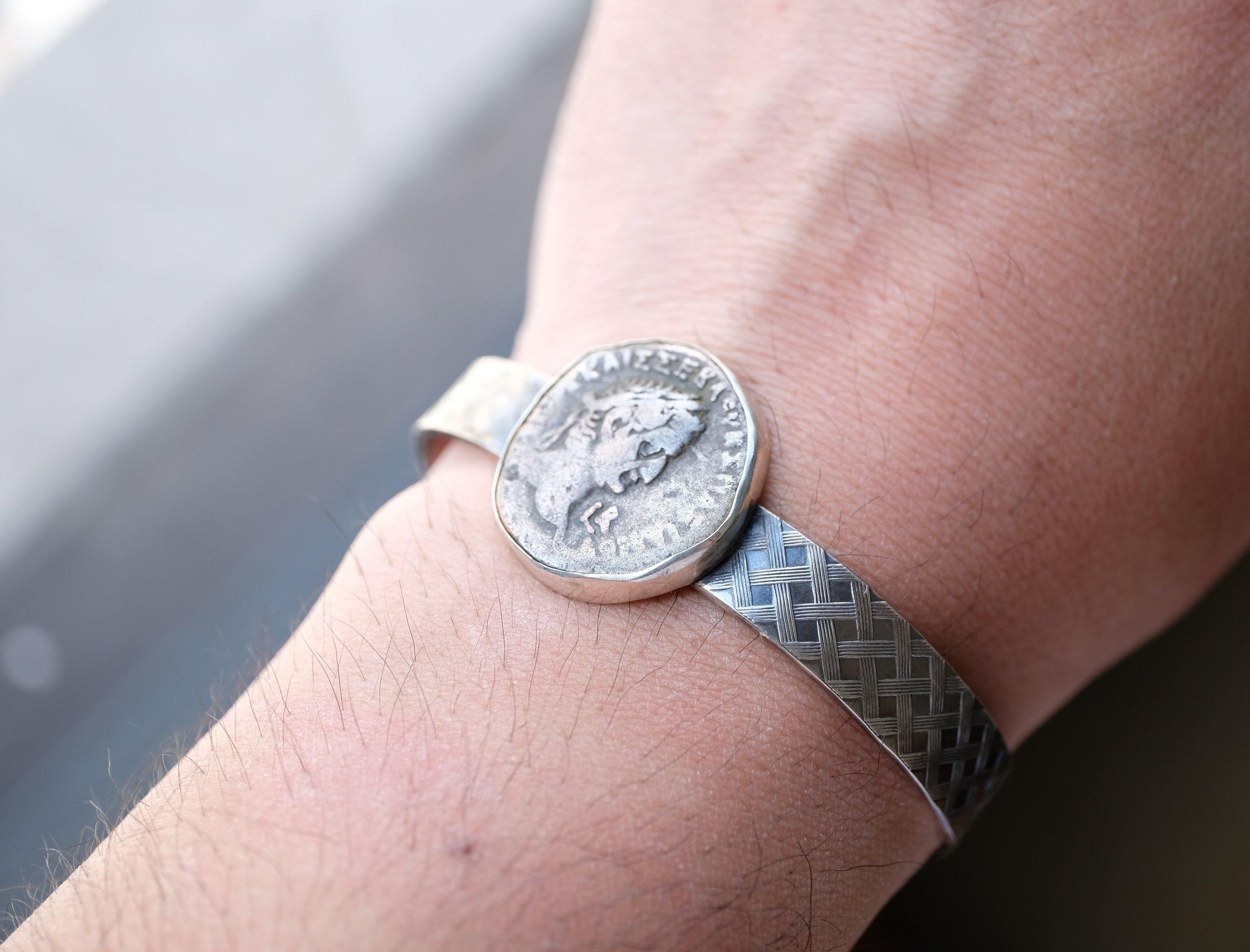 Comes with certificate which guarantees authenticity and provides background information (listed below) on the acquired coin

This is an awesome bracelet, carefully bezel set in sterling silver. 

The coin is a silver coin from Roman Egypt. 

Follow