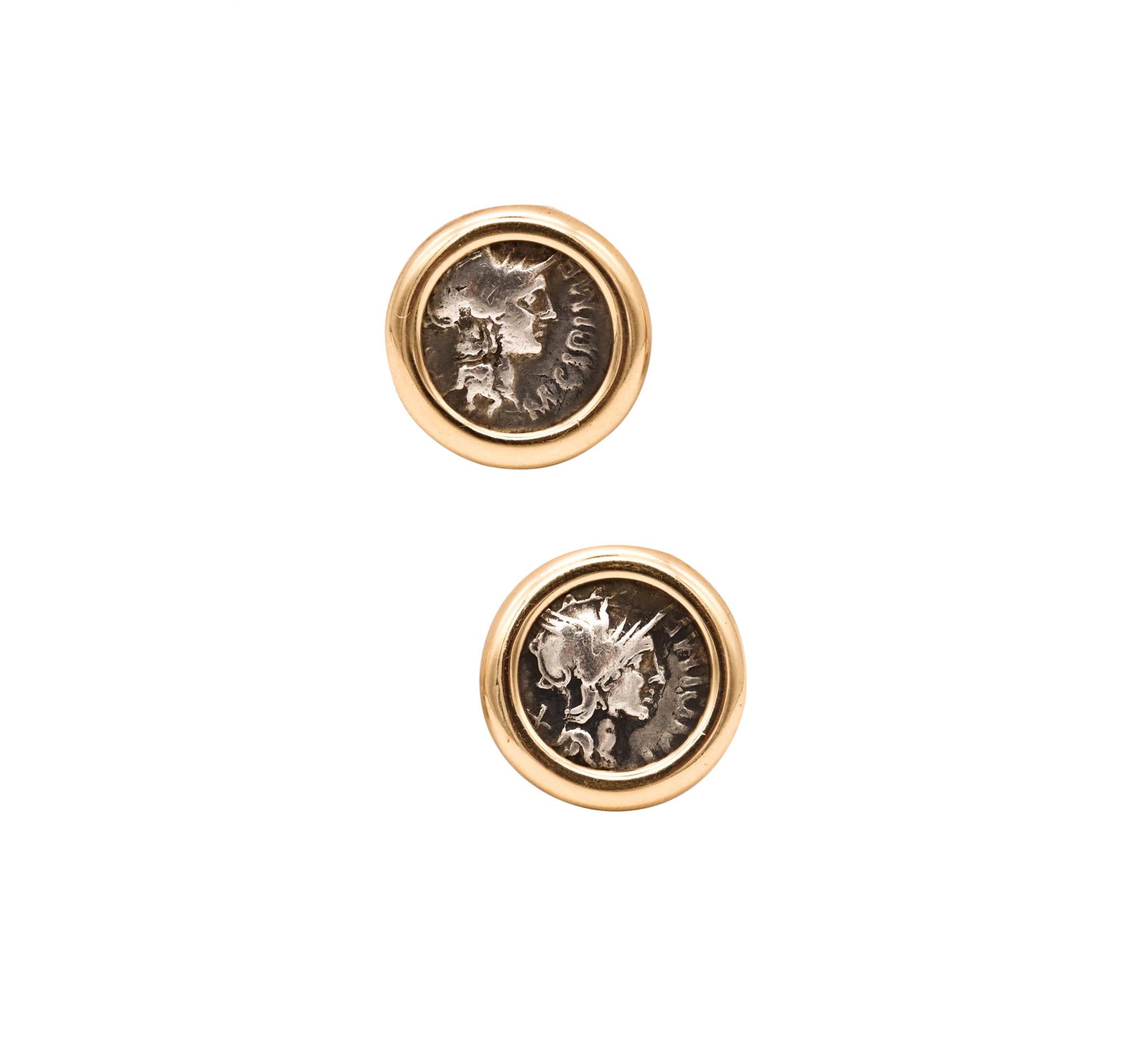 Pair of coin earrings with Ancient Romans Denari.

An elegant pair of ancient Rome coins earrings, crafted in solid yellow gold of 18 karats with high polished finish. They are fitted with post for pierced ears and comfortable omega backs for
