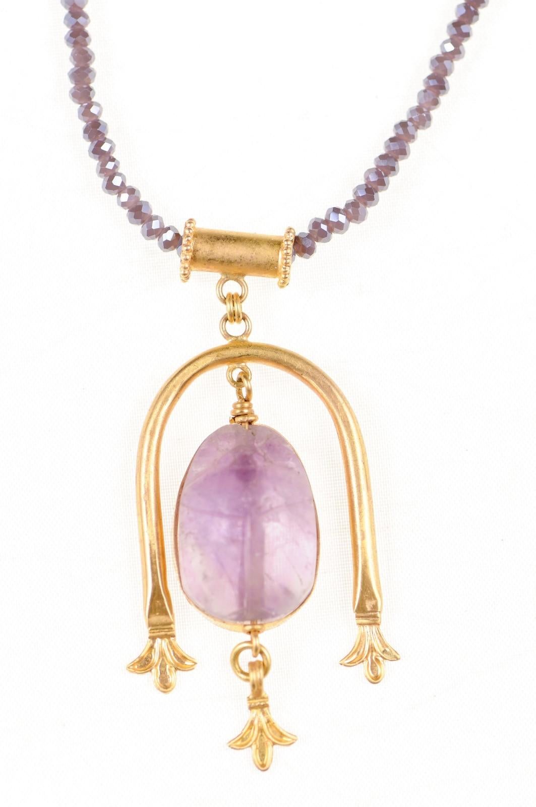 Roman Egypt lavender colored scarab (circa 100 BC to 100 AD) set into a custom 21K gold decorative u-drop pendant and bail. This gorgeous purple amethyst scarab, once likely adorned a ring or other piece of jewelry in centuries past. Overall pendant