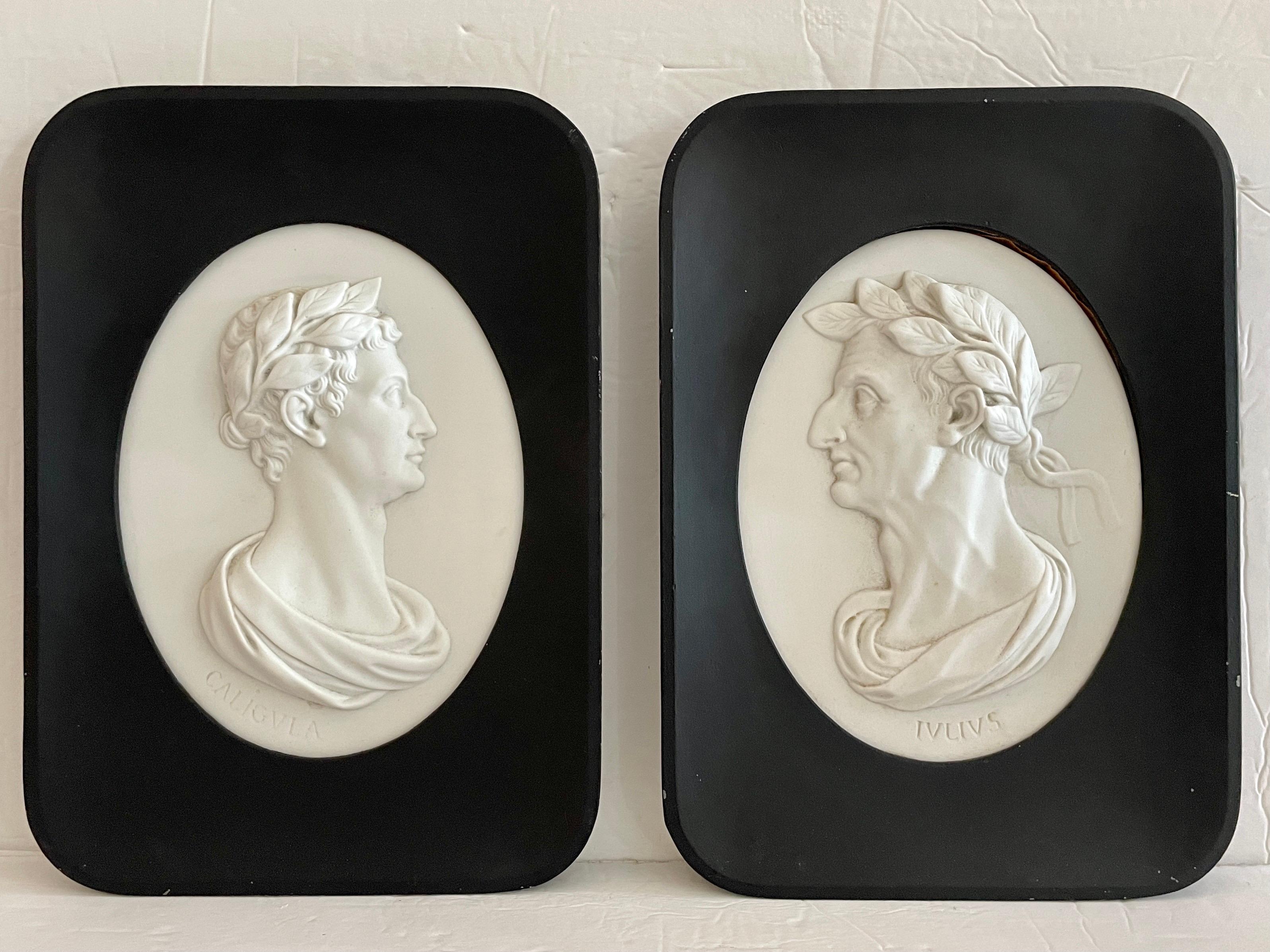 Pair of hanging wall plaques with the profiles of Roman emperors Caligula and Julius Caesar. Great addition to your walls and interiors.