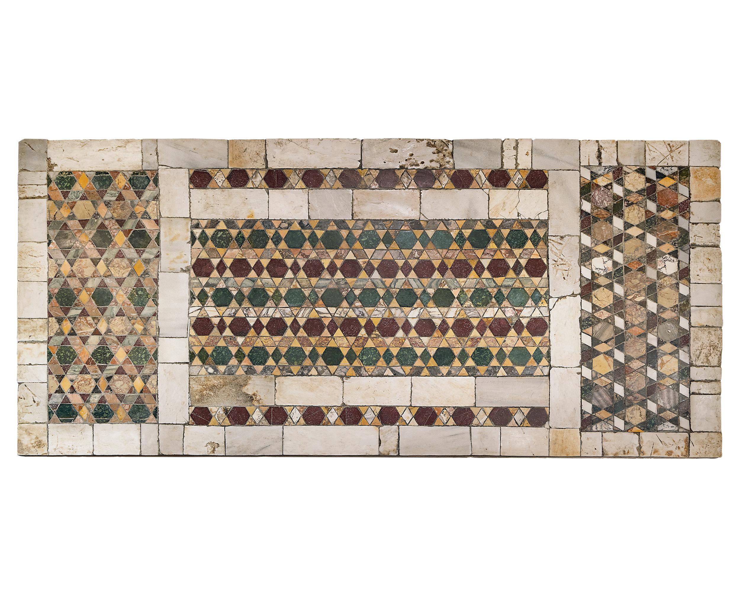 This exceptionally important Roman Empire pavement forming this table's top would have lined the walkways of only the most important buildings. Using a rare and ancient form of pietre dure known opus sectile, each hardstone would have been precisely