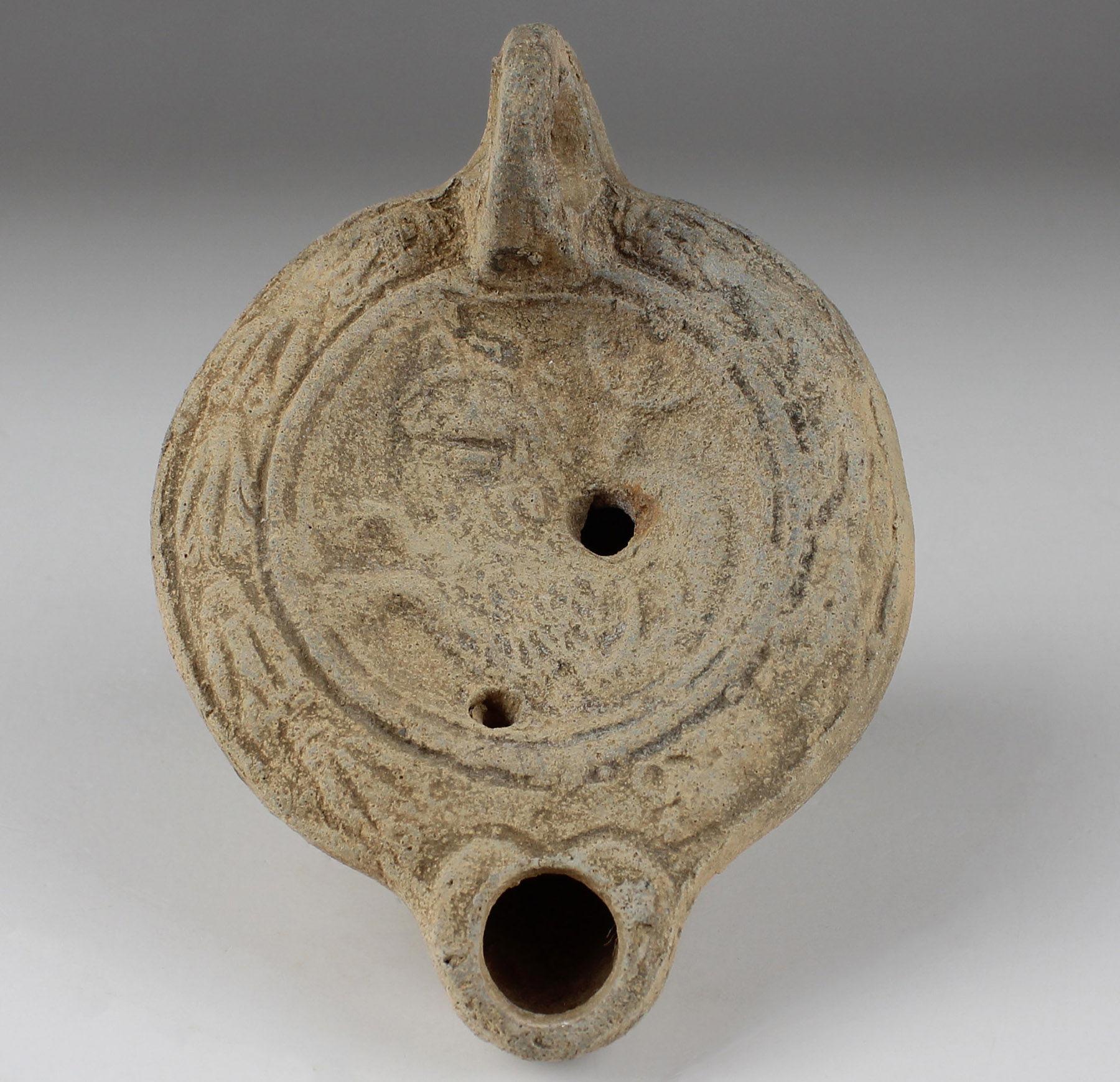 ITEM: Factory oil lamp with chimera, Type Bussière D X 4
MATERIAL: Terracotta
CULTURE: Roman
PERIOD: 175 – 250 A.D
DIMENSIONS: 40 mm x 70 mm x 98 mm
CONDITION: Good condition
PROVENANCE: Ex Emeritus collection (USA), collected from the 1950’s to the