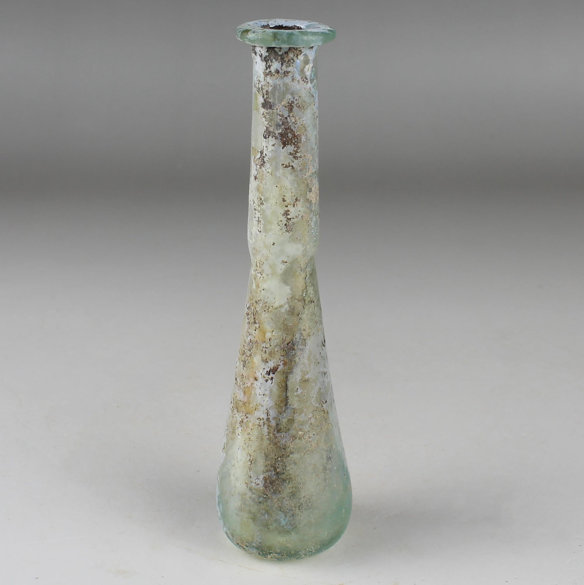 ITEM: Flask
MATERIAL: Glass
CULTURE: Roman
PERIOD: 1st – 3rd Century A.D
DIMENSIONS: 120 mm x 30 mm
CONDITION: Good condition
PROVENANCE: Ex French private collection, acquired between 1975 – 1990

Comes with Certificate of Authenticity and Export