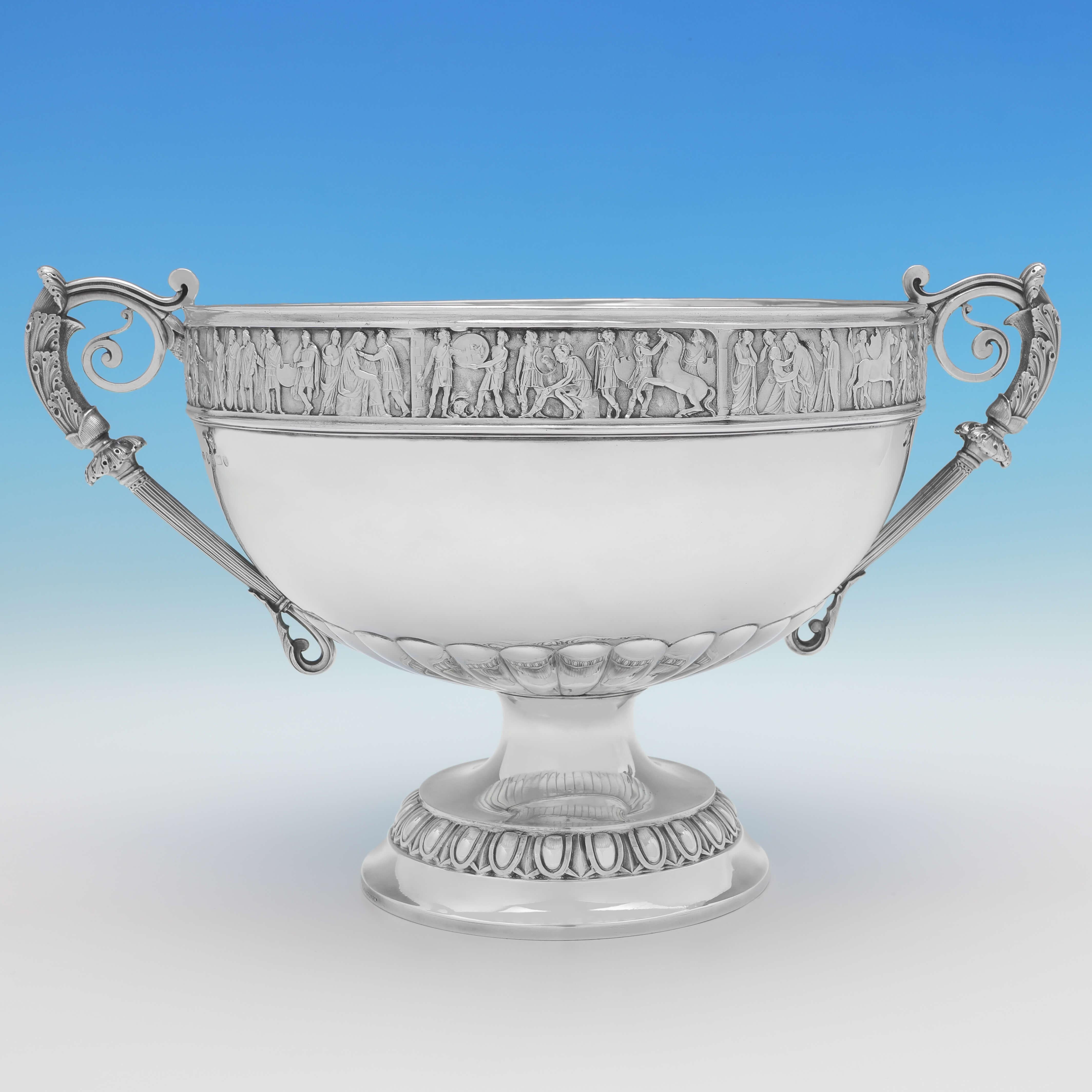 Hallmarked in Birmingham in 1887 by Elkington & Co., this striking, Victorian, antique sterling silver bowl, stands on a pedestal foot, and features acanthus detailed handles, and a border modelled as a classical Roman frieze. The bowl measures
