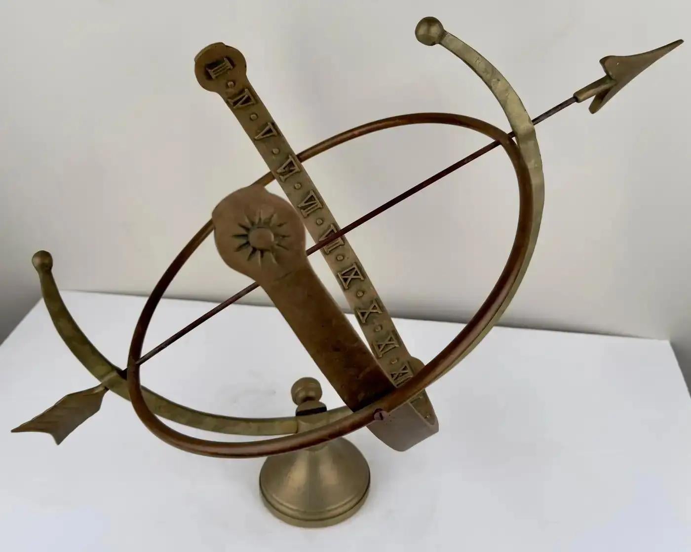 Presenting an exquisite antique Roman Armillary cast iron sundial garden ornament. This stunning piece features intricate Roman numerals and delicately crafted arrows, showcasing timeless elegance and historical charm. With its beautiful antique