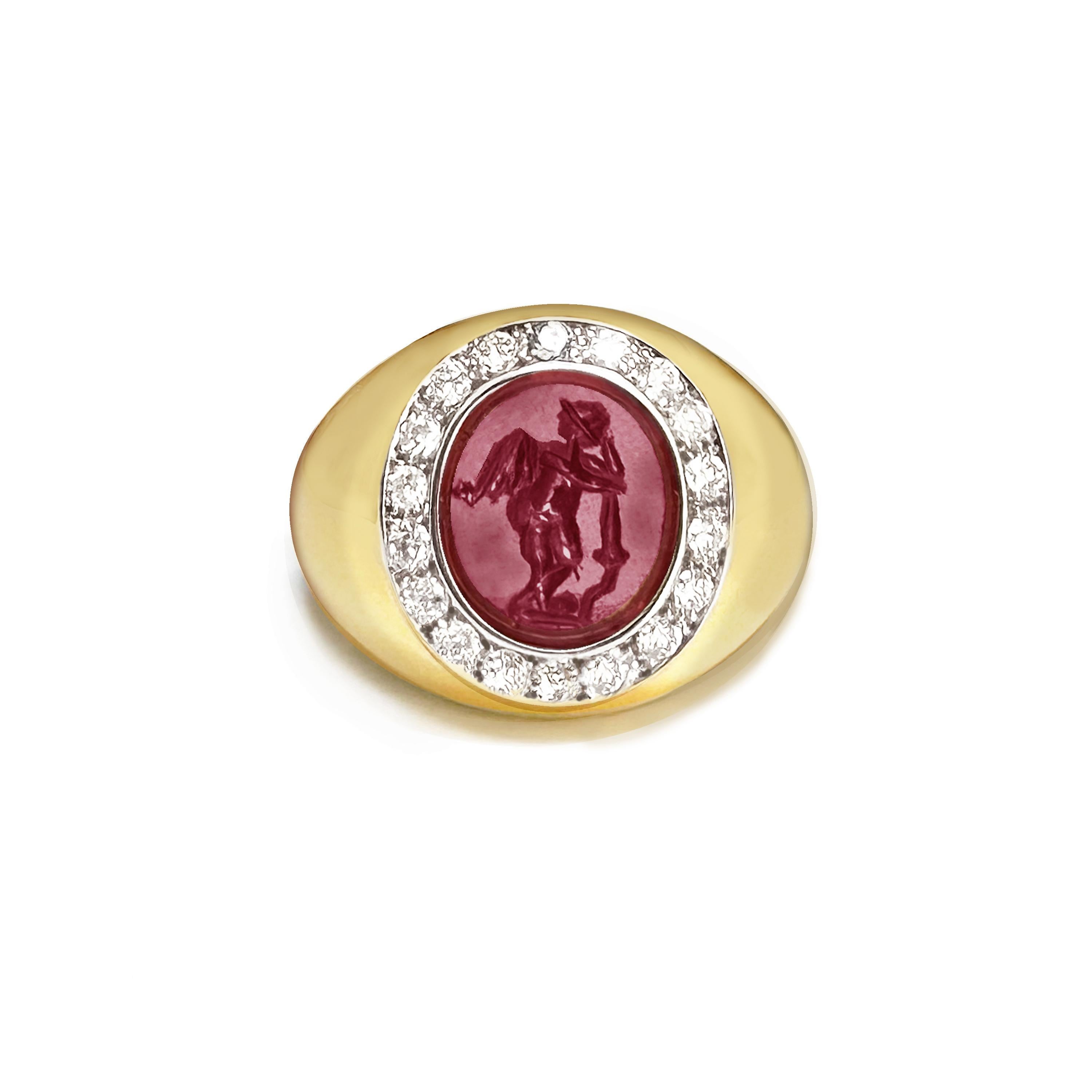This 18 Kt gold ring has been set with an authentic Roman intaglio, on garnet, which depicts a winged Cupid leaning on a torch. The central stone is surrounded by 18 diamonds for a total of 0.70 Cts.
The Romans called him Cupid, from the Latin word