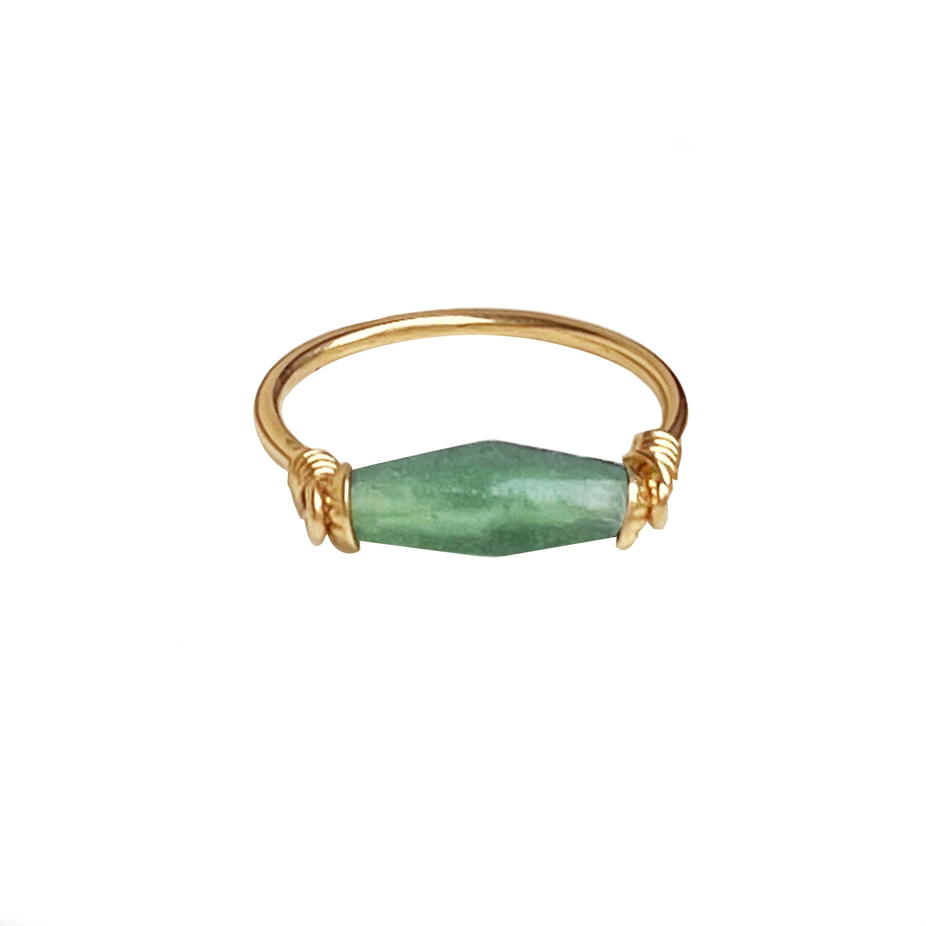 In this 18 Kt gold ring, a cylindrical Roman glass has been mounted ( 1st Century AD ) 

The production of Roman Glass can be traced back all the beginning of the 1st century AD. Initially, Roman Glass was produced and created using ancient