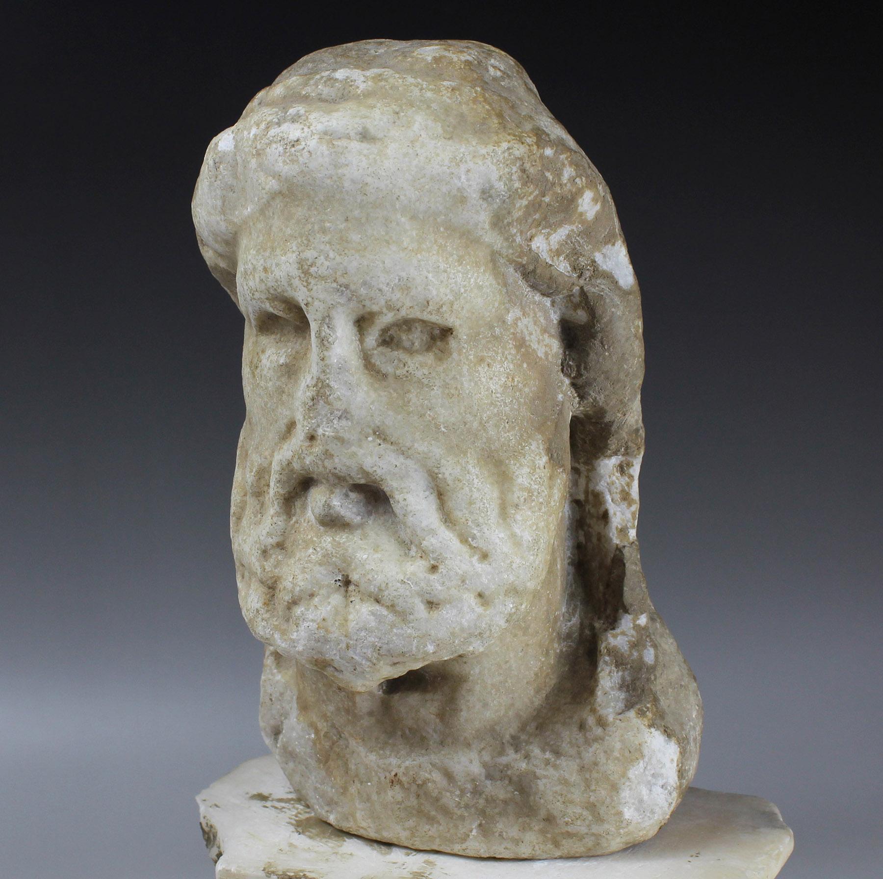 ITEM: Herm of Dionysos
MATERIAL: Marble
CULTURE: Roman
PERIOD: 1st – 2nd Century A.D
DIMENSIONS: 165 mm x 100 mm x 65 mm (without stand)
CONDITION: Good condition. Include stand
PROVENANCE: Ex European collection, Mr. L., bought on the French