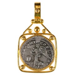 Ciondolo con moneta dell'imperatore romano Settimio Severo incastonato in oro 22k