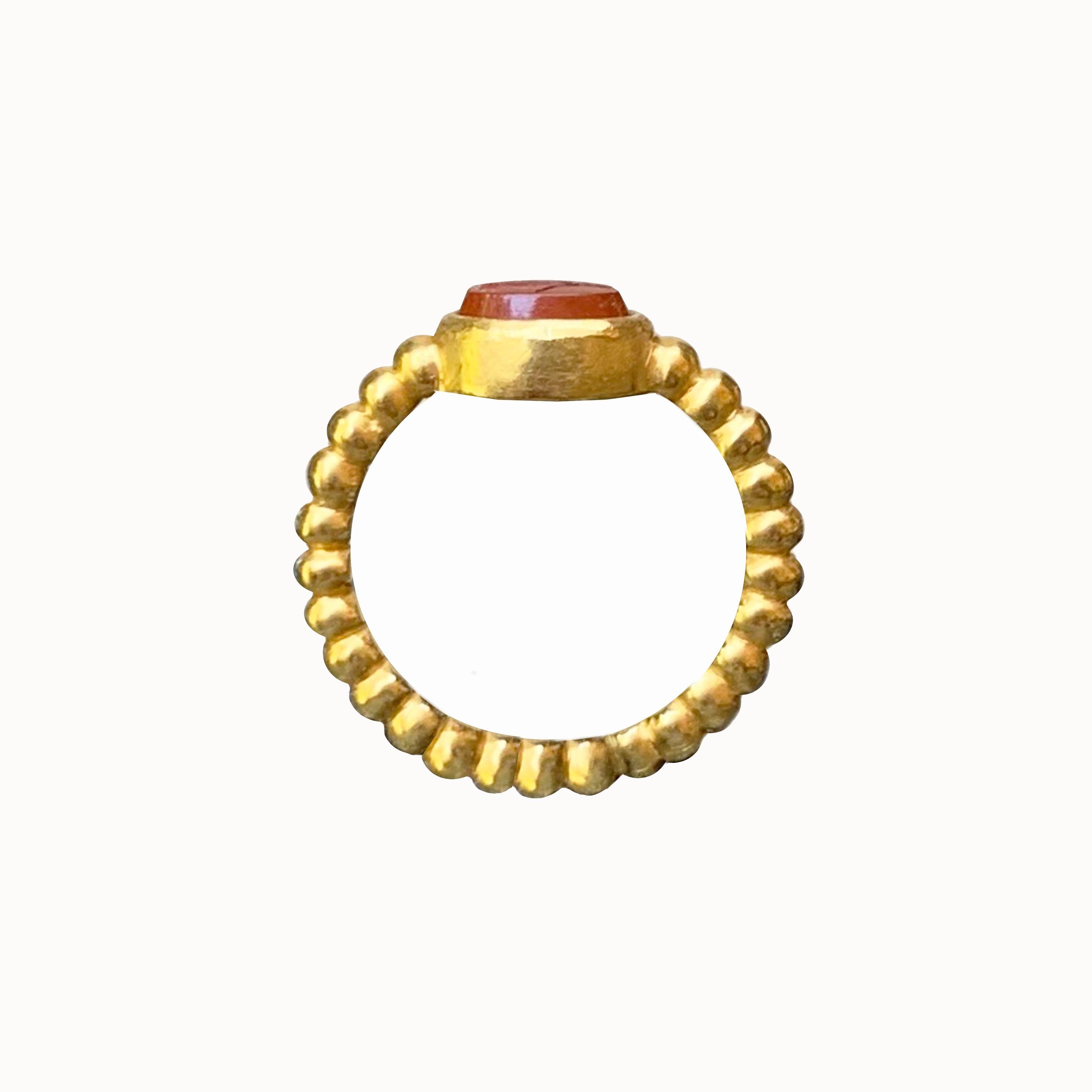 In this 18 Kt gold ring is set a  Roman intaglio on jasper, dating back to the 1st-2nd cent. AD , depicting Athena with spear and horn of plenty ( Cornucopia ) . Finger size : 6. 3/4  ( 14 italian ) 
The ring is entirely handmade by one of the