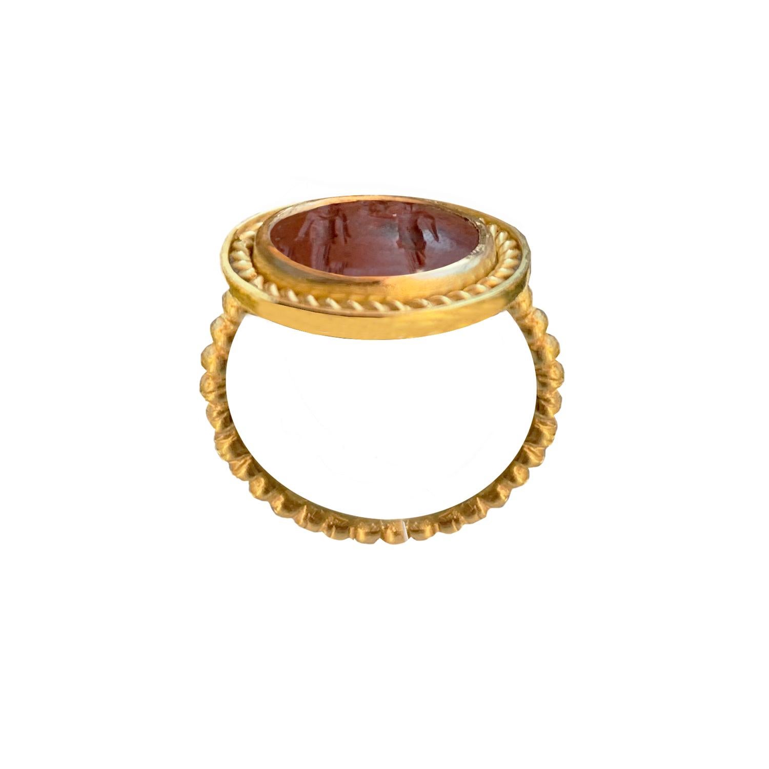 In this 18 Kr gold ring  there is an authentic roman intaglio on jasper, depicting Goddess Athena giving a winged Nike to an Emperor. 
Athena often given the epithet Pallas, is an ancient Greek goddess associated with wisdom, handicraft, and warfare
