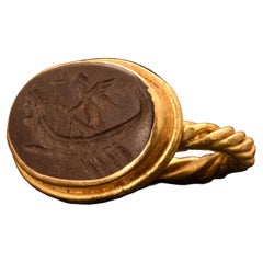 Bague romaine intaille de dieu ailé en or