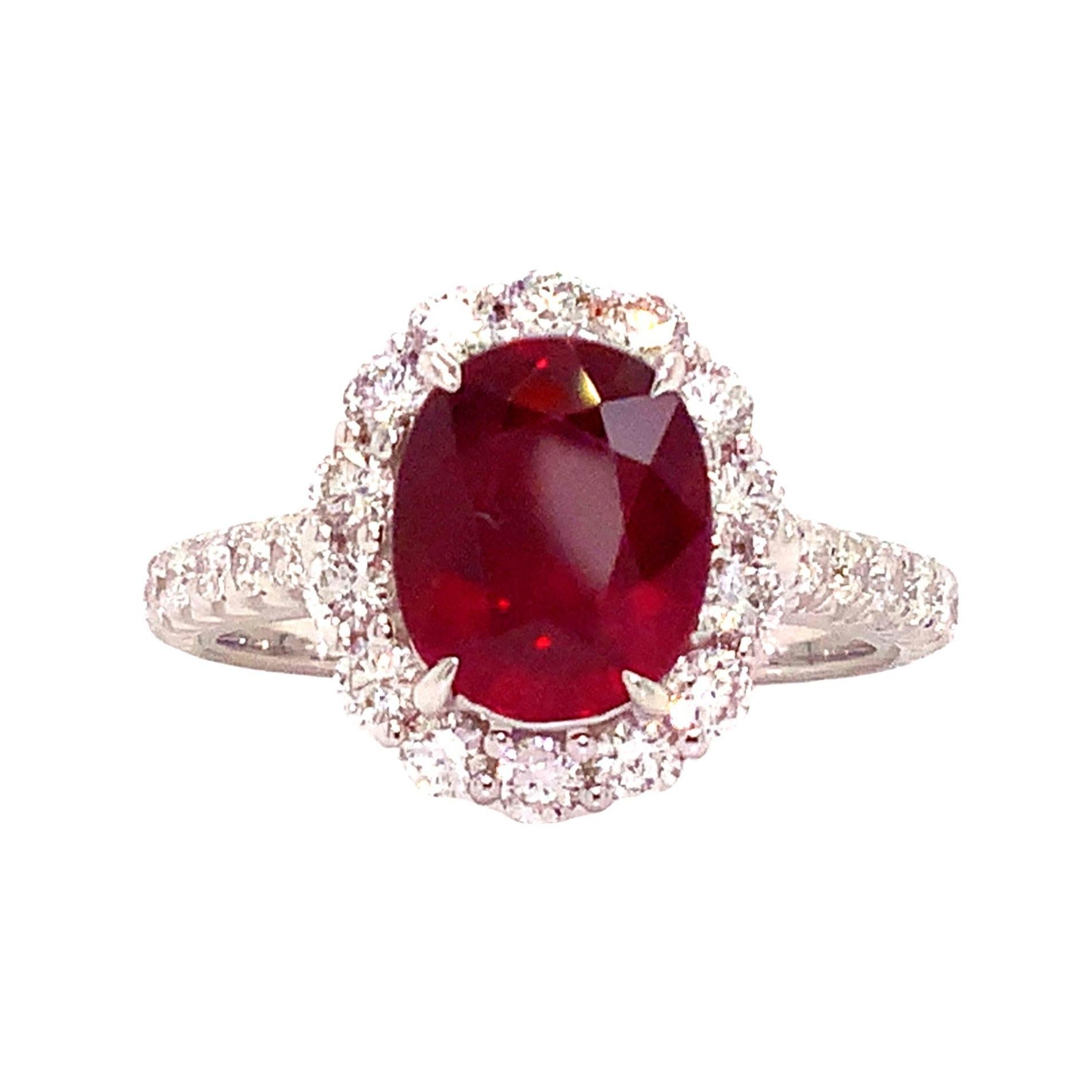 Roman + Jules Classic 2.52 ct Gem Quality Red Ruby and Diamond Halo Ring set in 18 Karat White Gold. This Truly Exceptional Ruby is very Rare and Precious. 
The Fire and Intensity that this One of a Kind Ruby Possesses is truly a Treasure worth