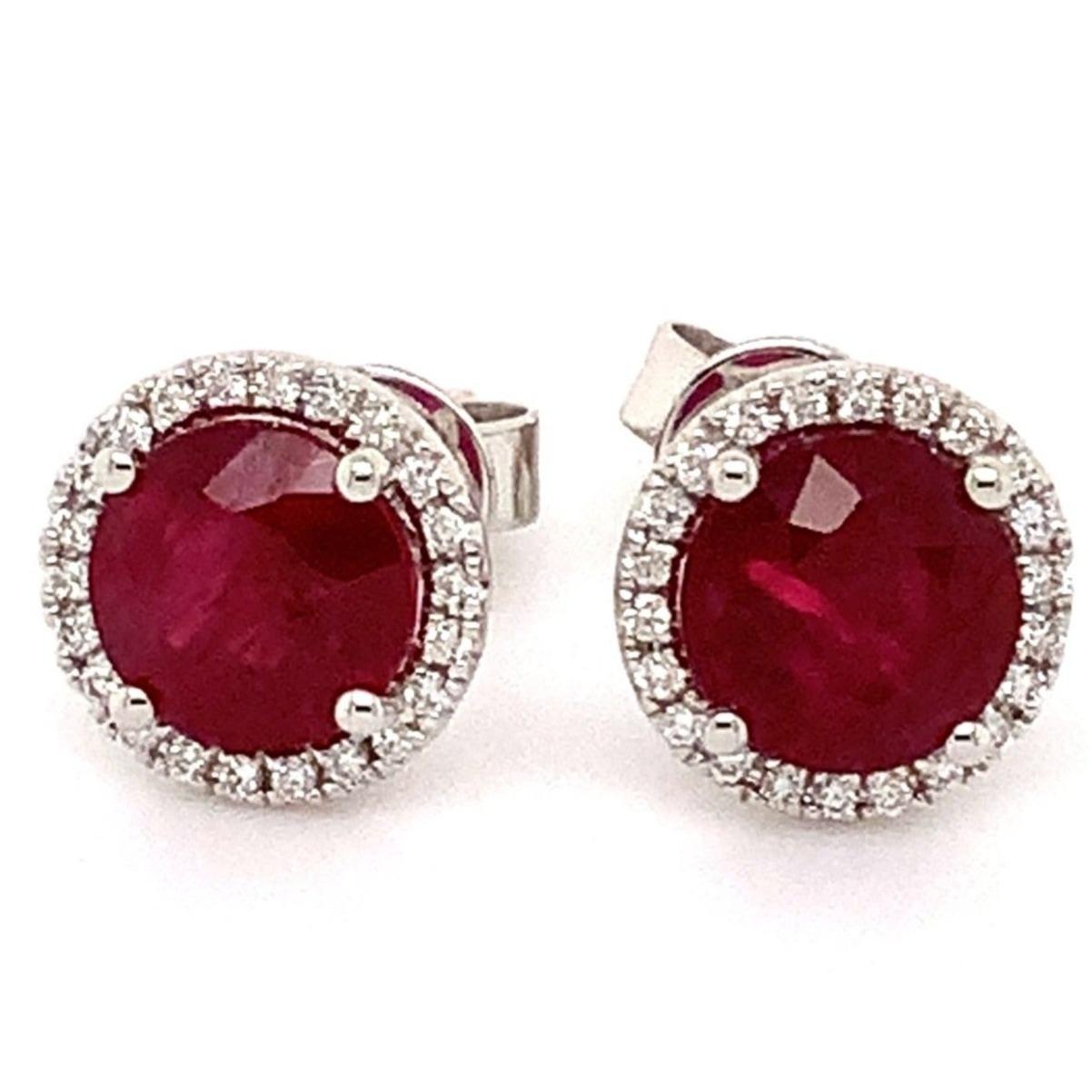 Roman + Jules Fine Quality Medium Dark Red Ruby Origin Thailand and Diamond Halo Earrings in 18 Kt White Gold.
6 mm Round Ruby stones 
2 Round Rubies Equal 2.21 cts. tw.
44 Round Brilliant Cut Diamonds 0.22 tw
G in Color SI in Clarity
8 mm in