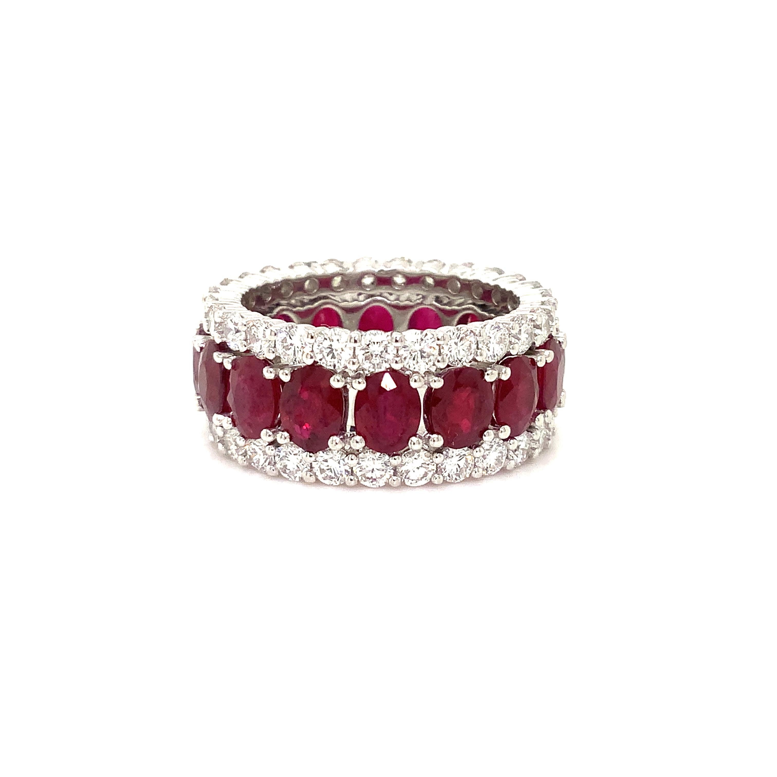 This extraordinary eternity ring features round-cut diamonds (2.36 TCW) arranged at its edges, complemented by 16 vertically set oval rubies (7.08 cts. tw.), of Dark Medium Red Intense Burmese Color and Very Good Clarity Make and Polish. The