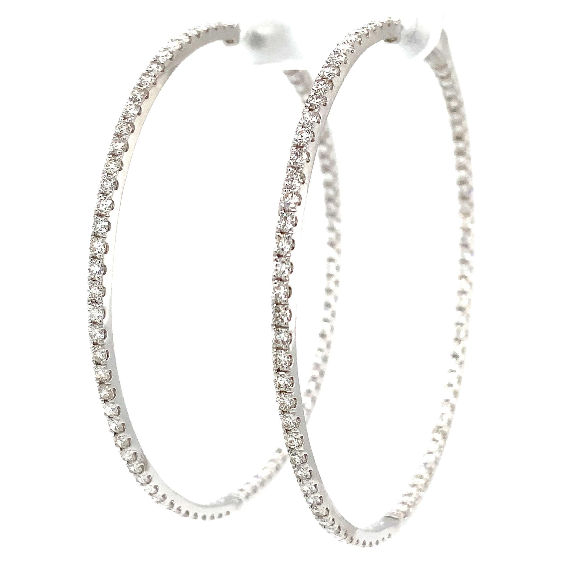 Roman + Jules Two Inch Diameter Round Shared Prong Diamond Hoop Set in 14K White Gold Post with Locking clutch Back for Security.  These Chicque Hoops will make you Look and Feel Great! Everyone should have a pair of these!
184 Round Diamond =2.00