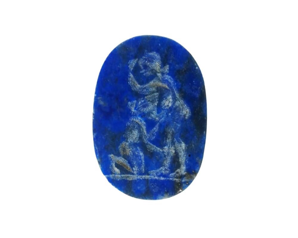 Roman Lapis Lazuli Intaglio seal with a carved erotic scene. Oval in shape, dark blue in color, smooth edge. The reverse side is flat. An erotic scene with a naked couple is depicted. Archaeological and Historical Wares, Jewelry Wares and
