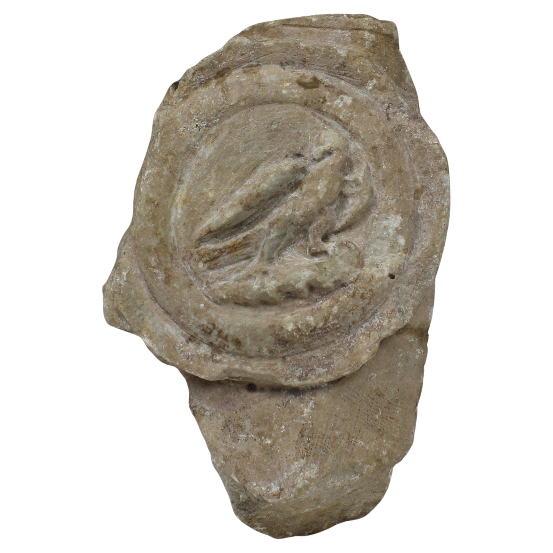 Roman lorica thoracata depicting a medallion with eagle, fragment