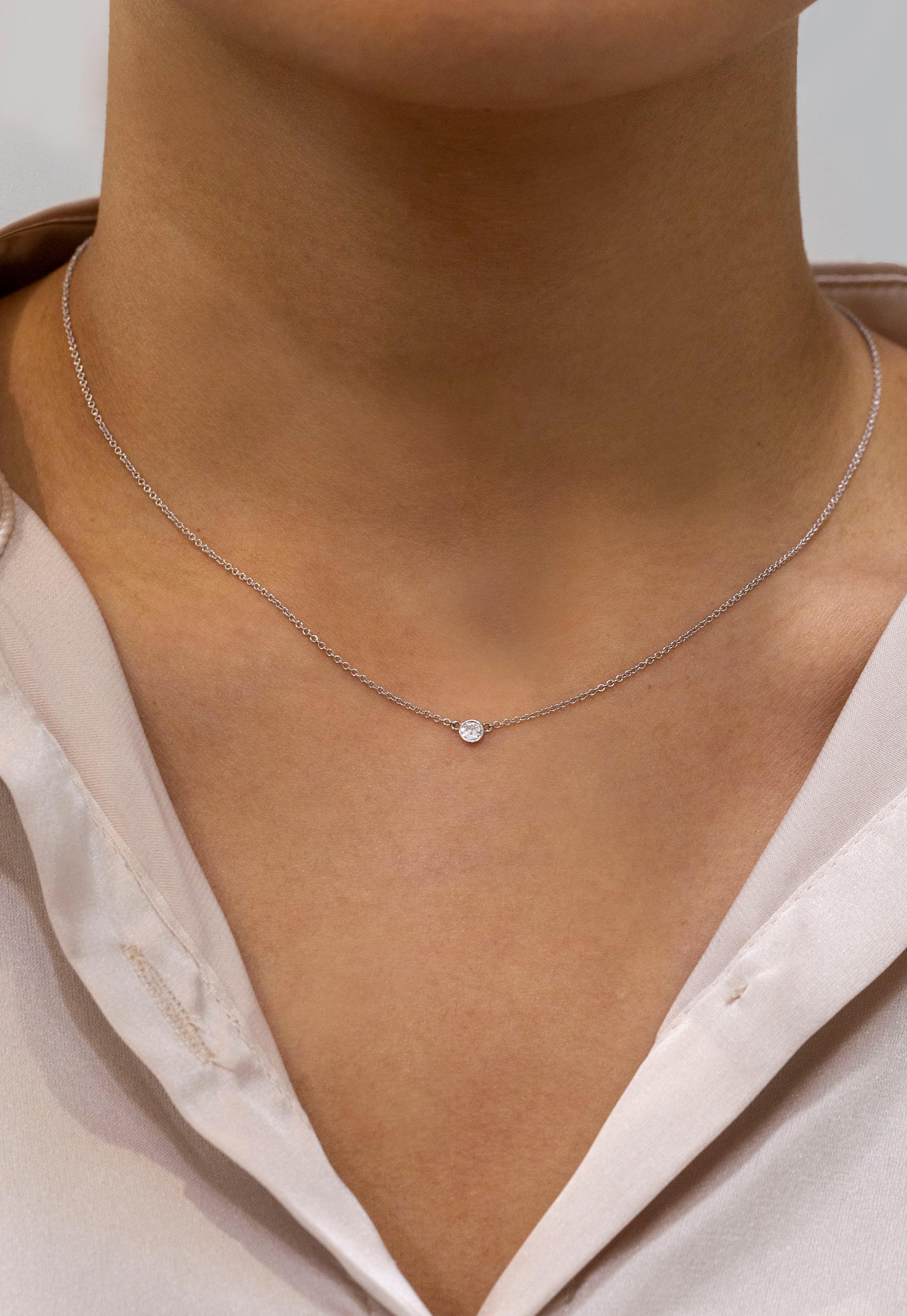 A simple and versatile solitaire pendant necklace showcasing a single 0.07 carat round diamond set in a 14K White Gold bezel. Attached to a 16 inch with an interval at 15 inch 14K White Gold Chain. 

Roman Malakov is a custom house, specializing in