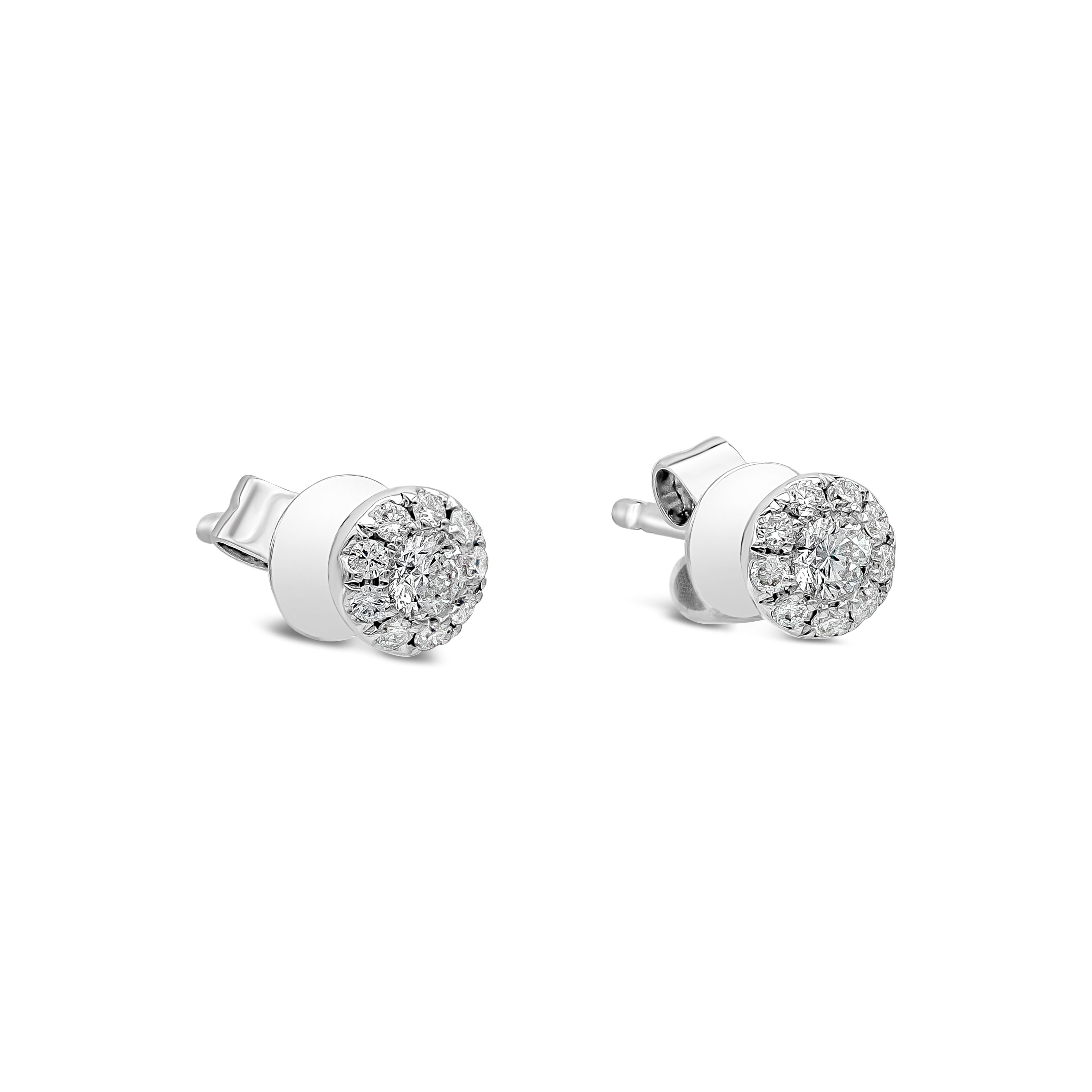 A classic pair of stud earrings showcasing a cluster of round brilliant diamonds set in an 18k white gold mounting. Diamonds weigh 0.21 carats total and are approximately F color, SI clarity. 

Style available in different price ranges. Prices are
