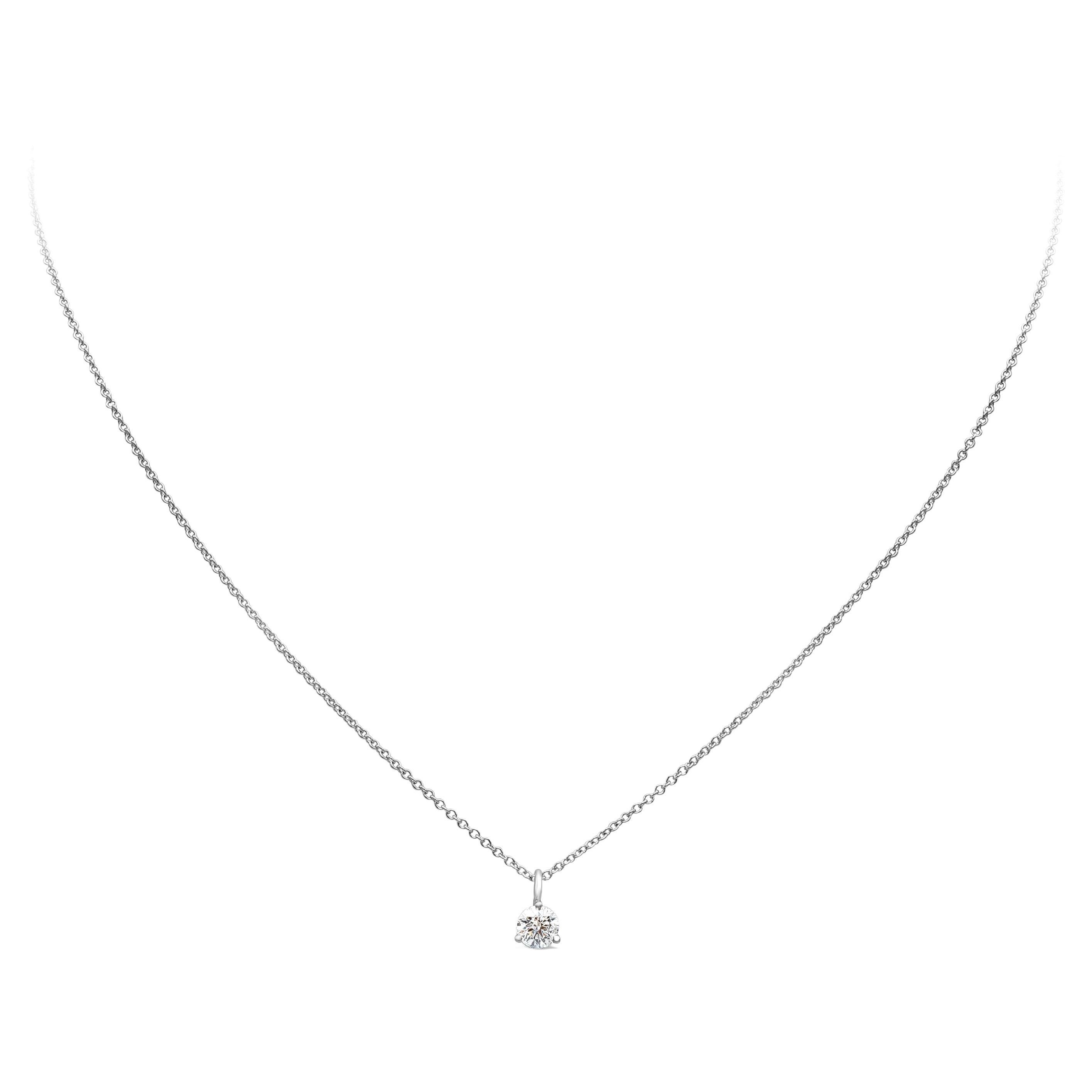 This simple and timeless pendant necklace showcases one brilliant round cut diamond. Diamond weighs 0.31 carats and mounted in a beautiful three prong setting. Made in 14 karat and 18 karat white gold. 

Style available in different price ranges.