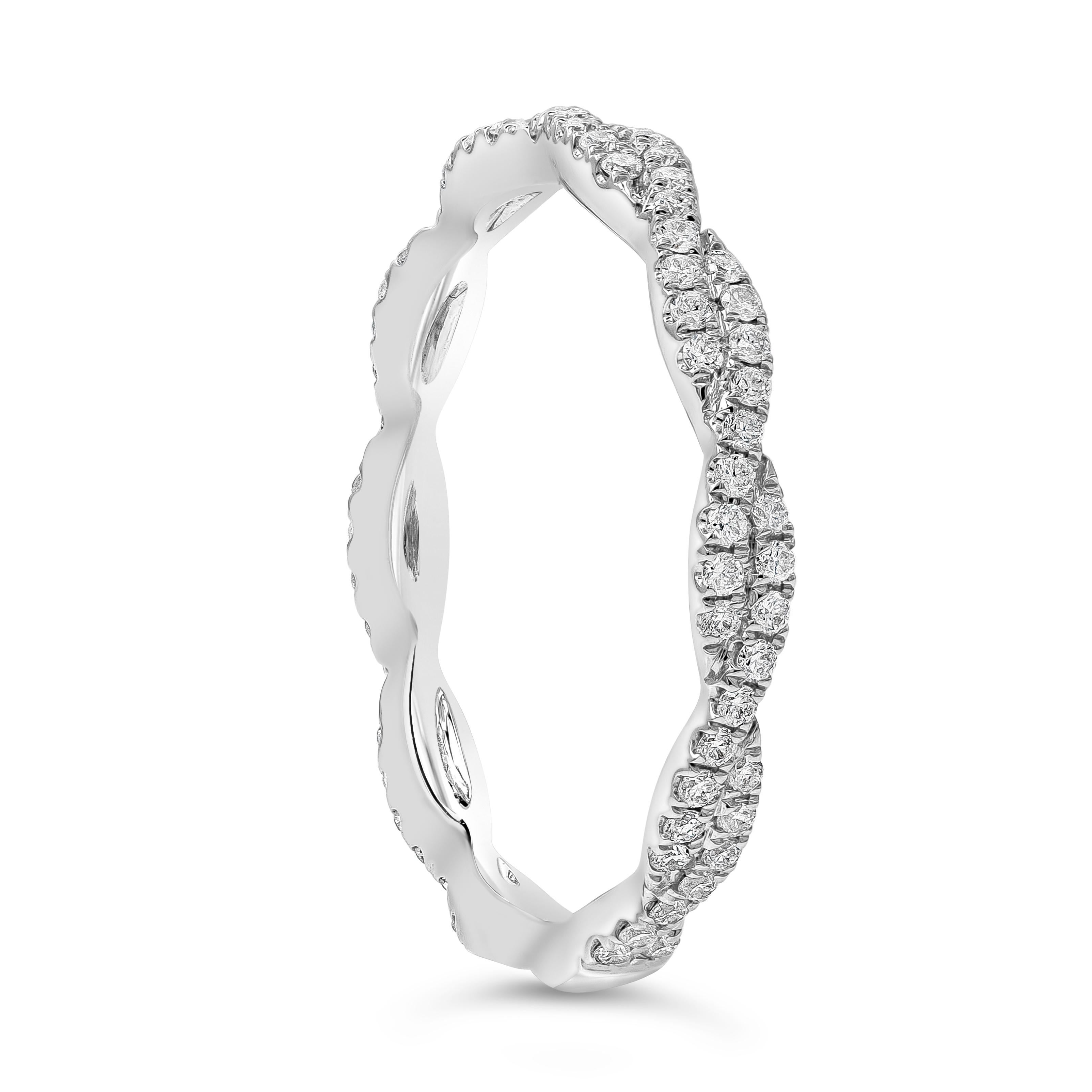 A unique wedding band style showcasing two rows of round brilliant diamonds weighing 0.36 carats total, G Color and VS in Clarity. set in an intertwined to form an infinity braided design. Made with 18K White Gold, Size 6.5 US resizable upon