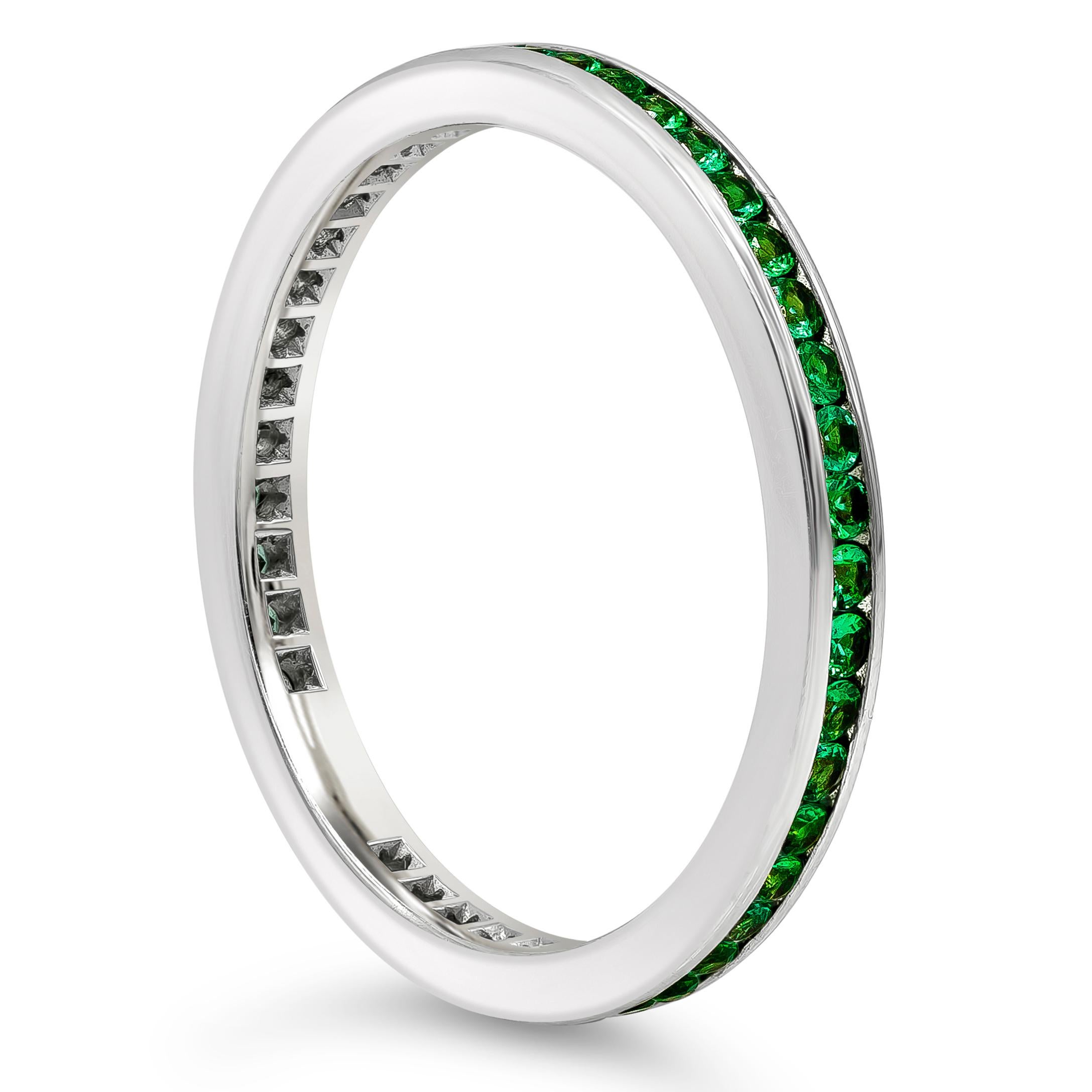 A classic wedding band style showcasing a row of color-rich round cut green emeralds weighing 0.38 carats total, set in a polished channel made of 18k white gold. Size 6.5 US resizable upon request.

Style available in different price ranges. Prices