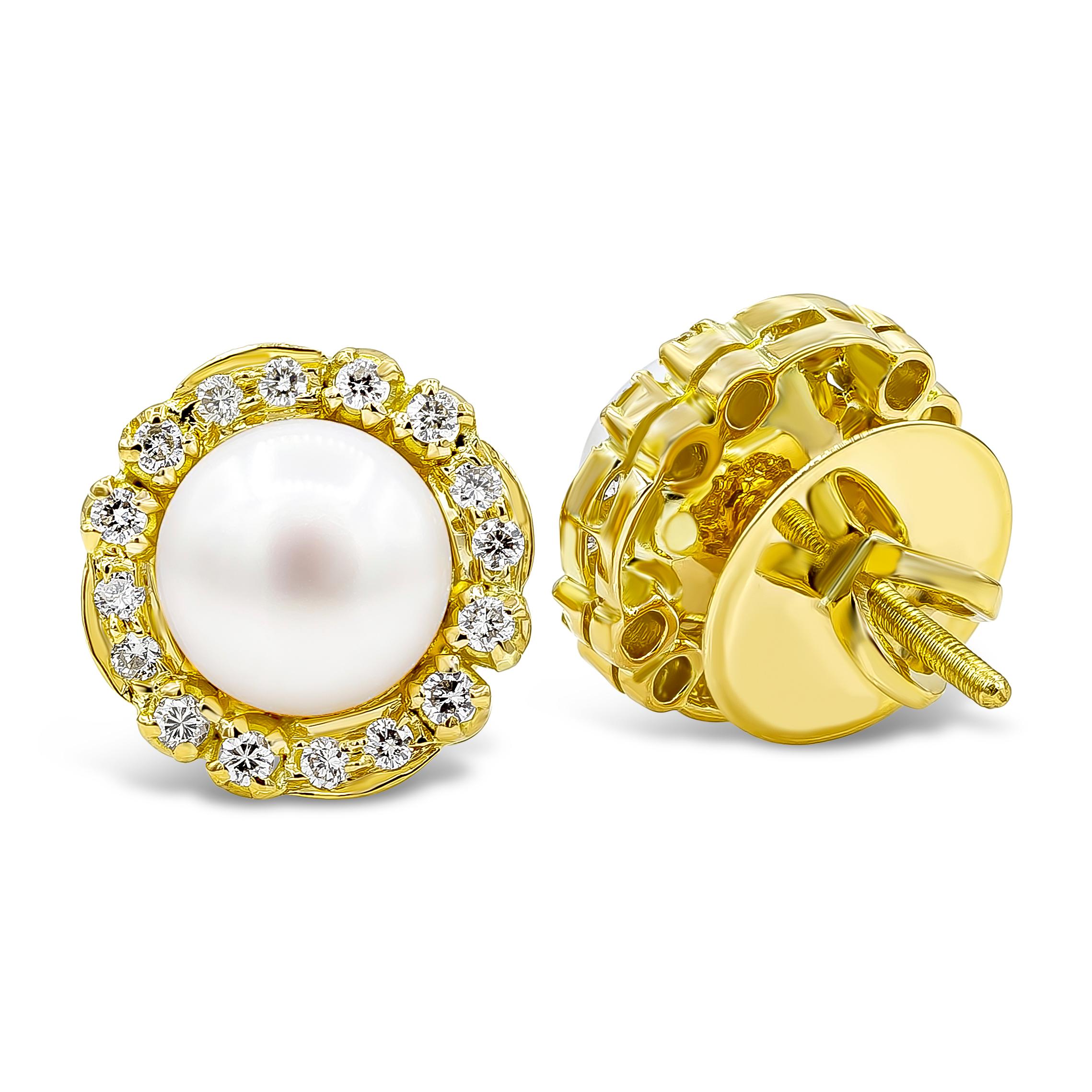 A lovely pair of earrings showcasing 13.25mm button pearls accented by brilliant round diamonds in a halo design weighing 0.38 carats total, G-H Color and SI in Clarity. Screw back post and made in 18K Yellow Gold.
