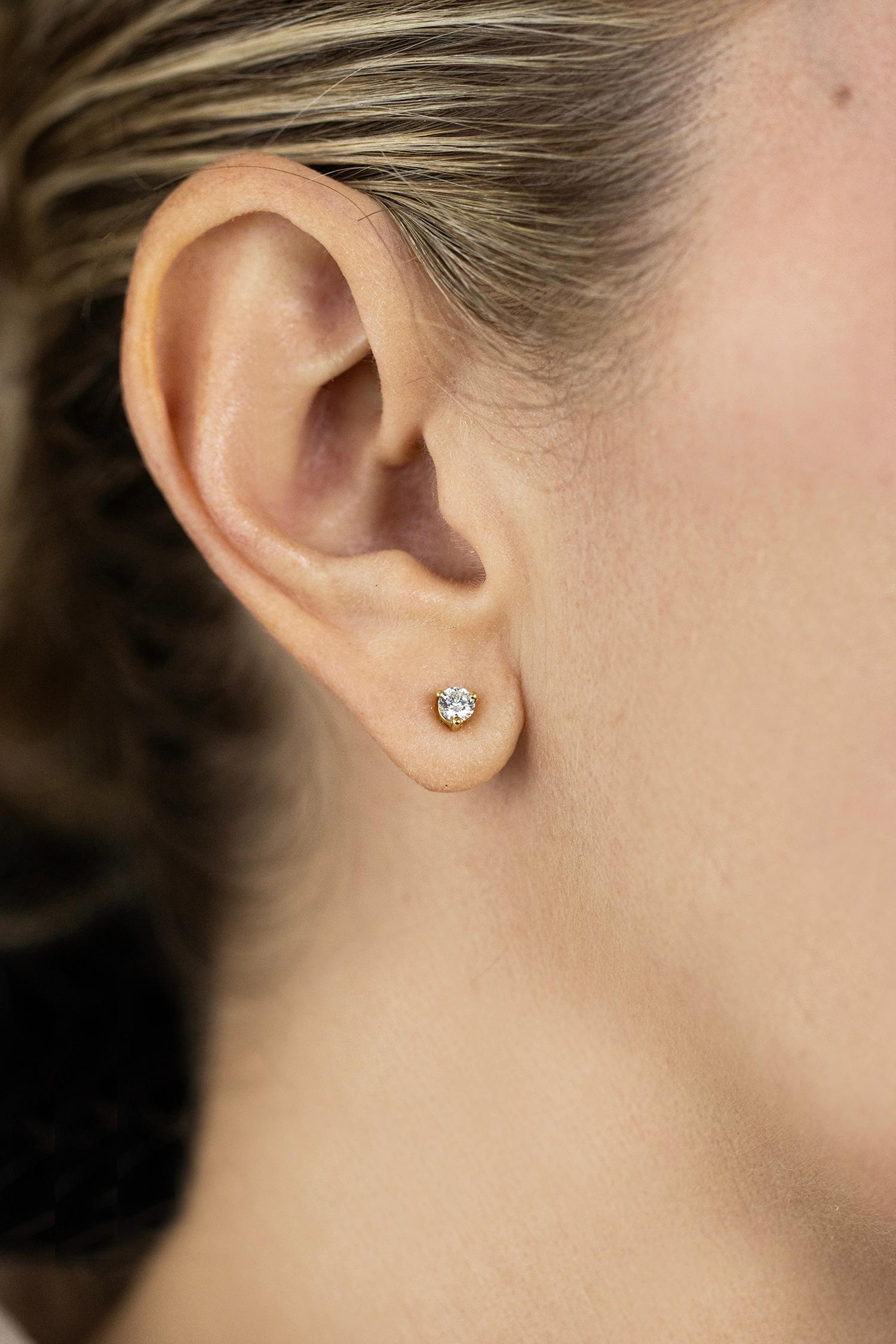 A simple stud earrings showcasing a brilliant round diamond weighing 0.40 carats total, set in a classic three-prong setting. Made in 18K Yellow Gold. Perfect for your everyday use. 

Roman Malakov is a custom house, specializing in creating
