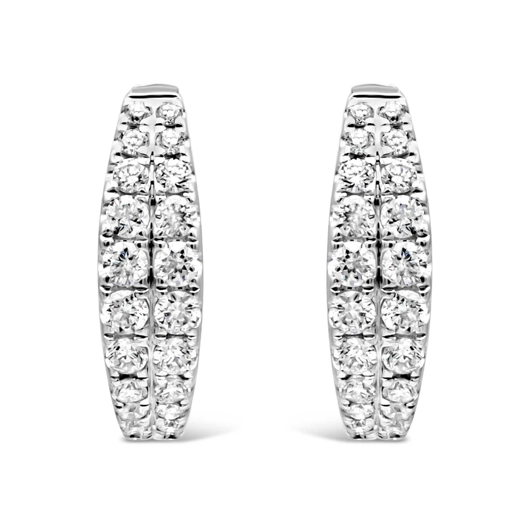 A simple for everyday wear huggie hoop earrings featuring a double row of 44 round brilliant diamonds weighing 0.40 carats total,  F color and VS in clarity, set in a micro-pave set half way and Finely made in 18K White Gold. 

Style available in