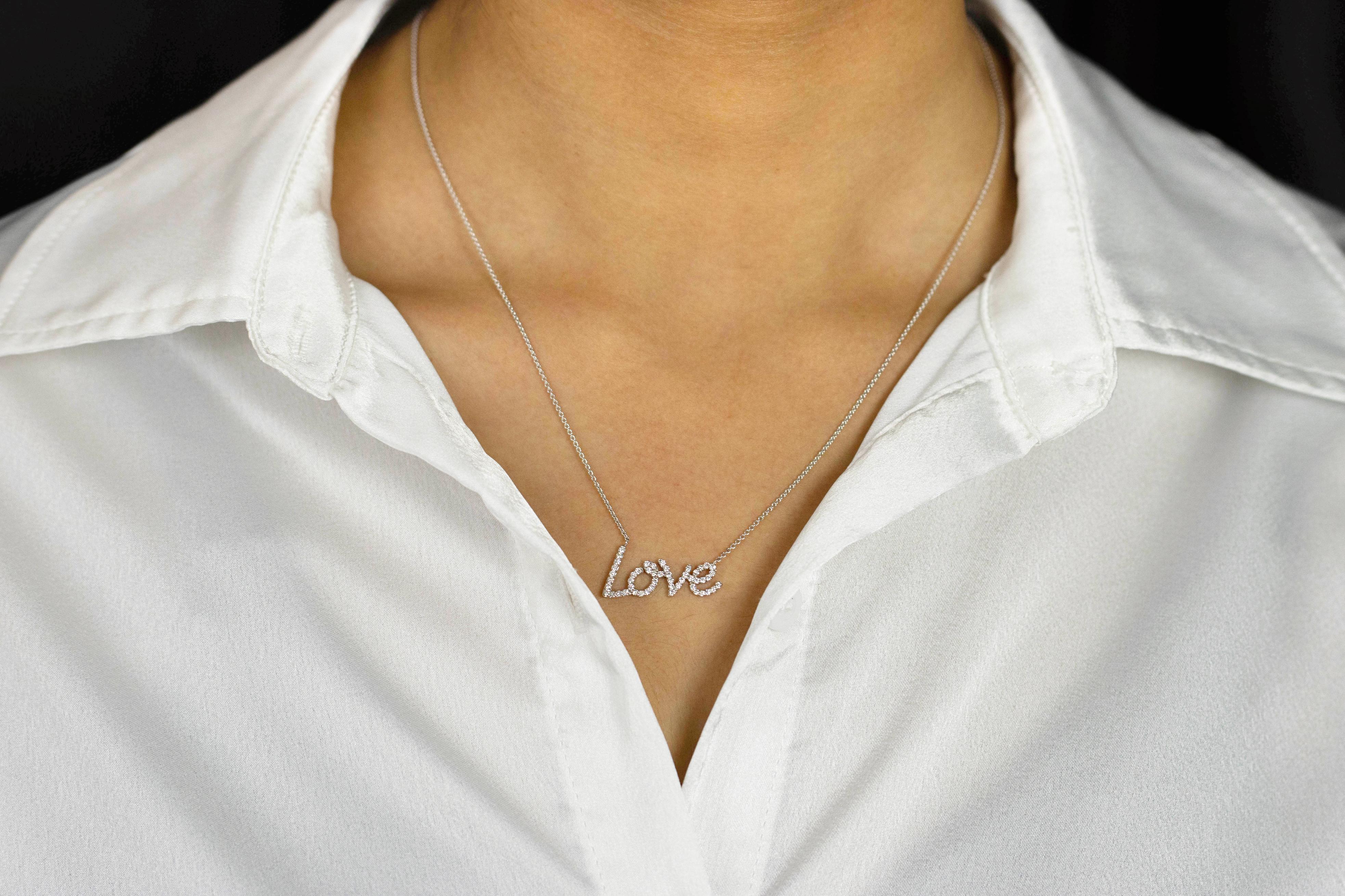 This fashionable and versatile pendant necklace showcasing an 18K white gold 